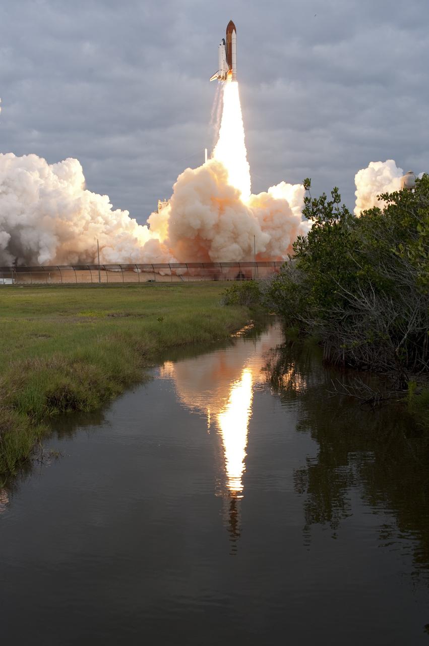 CAPE CANAVERAL, Fla. -- Amid the tranquility of a wildlife refuge, space shuttle Endeavour rumbles off Launch Pad 39A at NASA's Kennedy Space Center in Florida. Endeavour began its final flight, the STS-134 mission, to the International Space Station on time at 8:56 a.m. EDT on May 16.        Endeavour and its six-member crew are embarking on a mission to deliver the Alpha Magnetic Spectrometer-2 (AMS), Express Logistics Carrier-3, a high-pressure gas tank and additional spare parts for the Dextre robotic helper to the space station. Endeavour's first launch attempt on April 29 was scrubbed because of an issue associated with a faulty power distribution box called the aft load control assembly-2 (ALCA-2). For more information visit, www.nasa.gov/mission_pages/shuttle/shuttlemissions/sts134/index.html. Kennedy coexists with the Merritt Island National Wildlife Refuge, habitat to more than 310 species of birds, 25 mammals, 117 fish and 65 amphibians and reptiles. Photo credit: NASA/Tony Gray and Tom Farrar