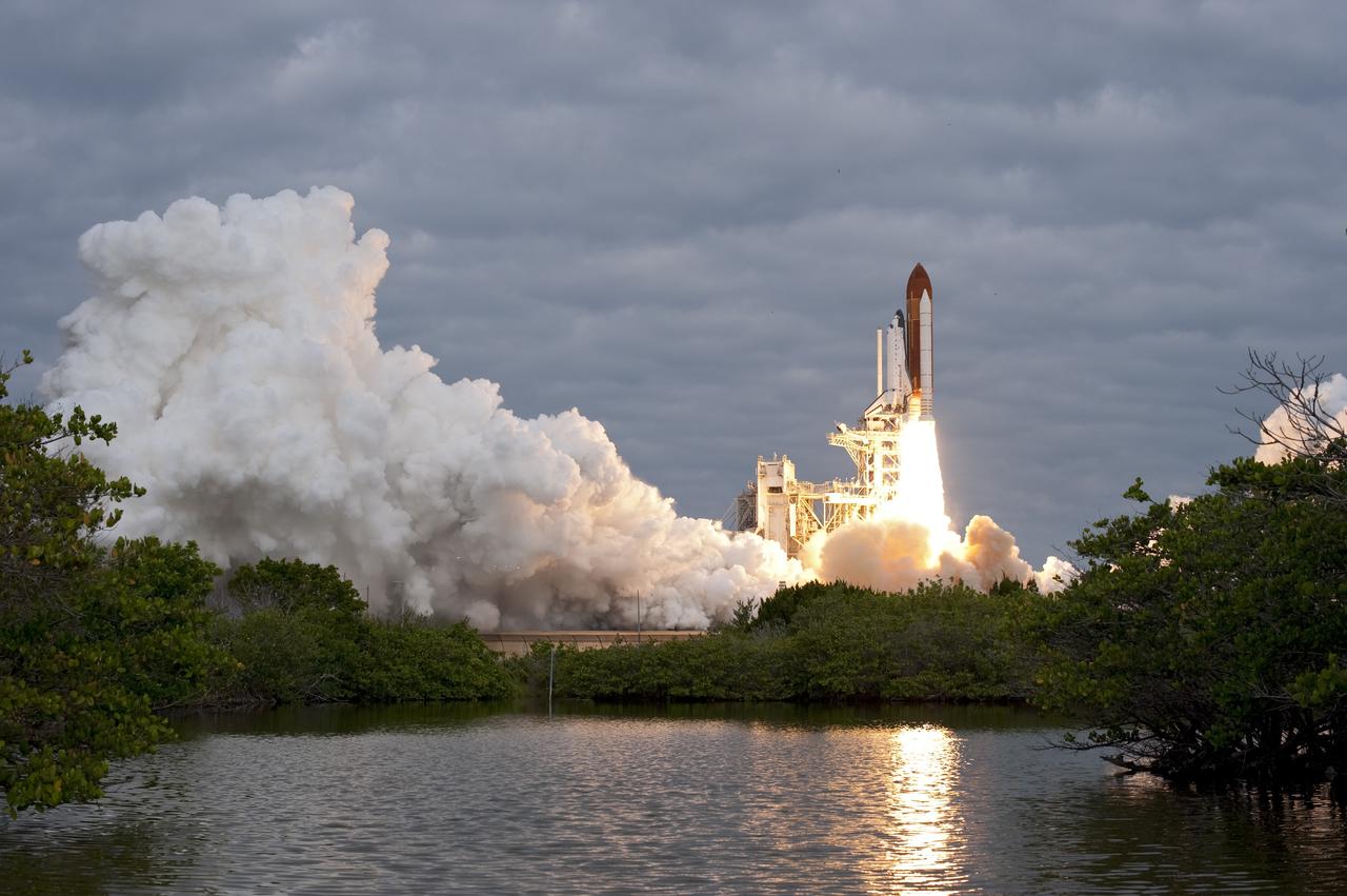 CAPE CANAVERAL, Fla. -- Amid the tranquility of a wildlife refuge, space shuttle Endeavour rumbles off Launch Pad 39A at NASA's Kennedy Space Center in Florida. Endeavour began its final flight, the STS-134 mission, to the International Space Station on time at 8:56 a.m. EDT on May 16.        Endeavour and its six-member crew are embarking on a mission to deliver the Alpha Magnetic Spectrometer-2 (AMS), Express Logistics Carrier-3, a high-pressure gas tank and additional spare parts for the Dextre robotic helper to the space station. Endeavour's first launch attempt on April 29 was scrubbed because of an issue associated with a faulty power distribution box called the aft load control assembly-2 (ALCA-2). For more information visit, www.nasa.gov/mission_pages/shuttle/shuttlemissions/sts134/index.html. Kennedy coexists with the Merritt Island National Wildlife Refuge, habitat to more than 310 species of birds, 25 mammals, 117 fish and 65 amphibians and reptiles. Photo credit: NASA/Sandra Joseph and Kevin O'Connell