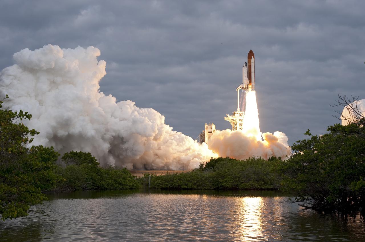 CAPE CANAVERAL, Fla. -- Amid the tranquility of a wildlife refuge, space shuttle Endeavour rumbles off Launch Pad 39A at NASA's Kennedy Space Center in Florida. Endeavour began its final flight, the STS-134 mission, to the International Space Station on time at 8:56 a.m. EDT on May 16.        Endeavour and its six-member crew are embarking on a mission to deliver the Alpha Magnetic Spectrometer-2 (AMS), Express Logistics Carrier-3, a high-pressure gas tank and additional spare parts for the Dextre robotic helper to the space station. Endeavour's first launch attempt on April 29 was scrubbed because of an issue associated with a faulty power distribution box called the aft load control assembly-2 (ALCA-2). For more information visit, www.nasa.gov/mission_pages/shuttle/shuttlemissions/sts134/index.html. Kennedy coexists with the Merritt Island National Wildlife Refuge, habitat to more than 310 species of birds, 25 mammals, 117 fish and 65 amphibians and reptiles. Photo credit: NASA/Sandra Joseph and Kevin O'Connell