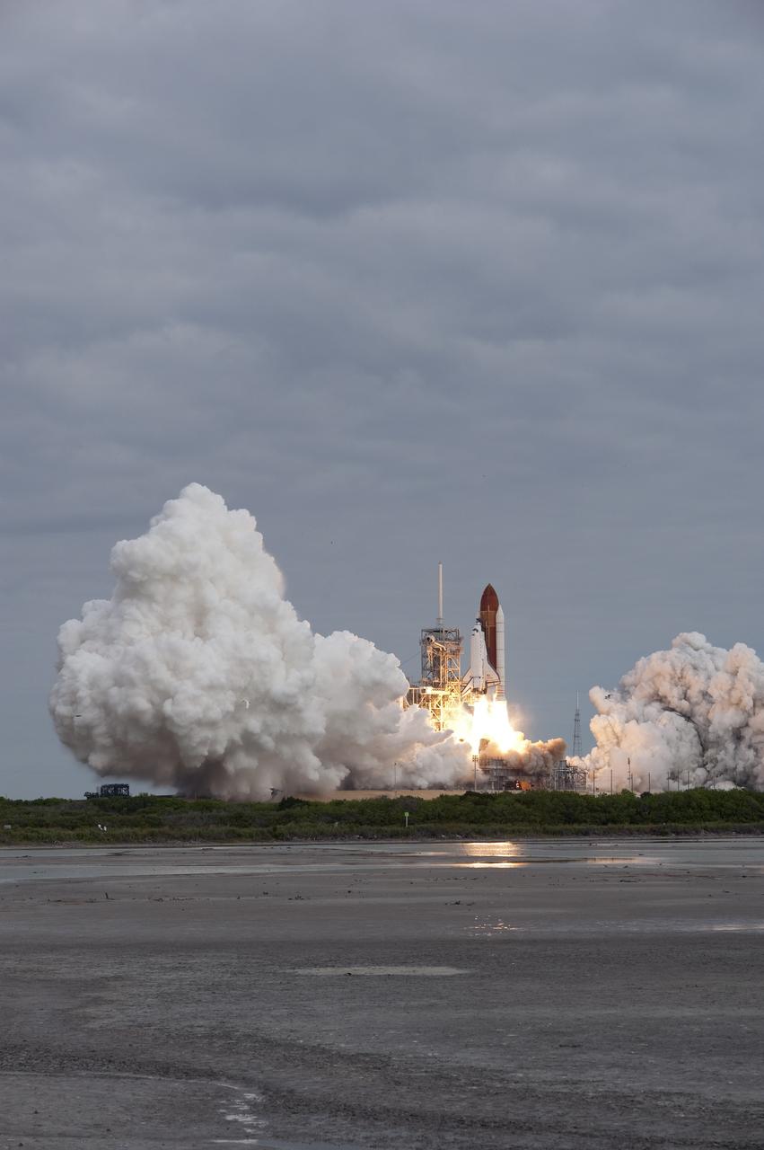 CAPE CANAVERAL, Fla. -- Amid the tranquility of a wildlife refuge, space shuttle Endeavour rumbles off Launch Pad 39A at NASA's Kennedy Space Center in Florida. Endeavour began its final flight, the STS-134 mission, to the International Space Station on time at 8:56 a.m. EDT on May 16.          Endeavour and its six-member crew are embarking on a mission to deliver the Alpha Magnetic Spectrometer-2 (AMS), Express Logistics Carrier-3, a high-pressure gas tank and additional spare parts for the Dextre robotic helper to the space station. Endeavour's first launch attempt on April 29 was scrubbed because of an issue associated with a faulty power distribution box called the aft load control assembly-2 (ALCA-2). For more information visit, www.nasa.gov/mission_pages/shuttle/shuttlemissions/sts134/index.html. Kennedy coexists with the Merritt Island National Wildlife Refuge, habitat to more than 310 species of birds, 25 mammals, 117 fish and 65 amphibians and reptiles. Photo credit: NASA/Sandra Joseph and Kevin O'Connell