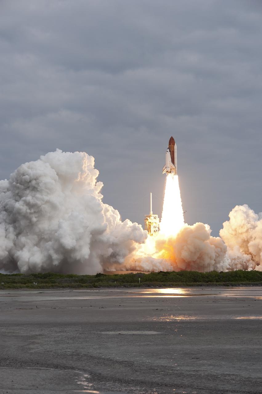 CAPE CANAVERAL, Fla. -- Amid the tranquility of a wildlife refuge, space shuttle Endeavour rumbles off Launch Pad 39A at NASA's Kennedy Space Center in Florida. Endeavour began its final flight, the STS-134 mission, to the International Space Station on time at 8:56 a.m. EDT on May 16.          Endeavour and its six-member crew are embarking on a mission to deliver the Alpha Magnetic Spectrometer-2 (AMS), Express Logistics Carrier-3, a high-pressure gas tank and additional spare parts for the Dextre robotic helper to the space station. Endeavour's first launch attempt on April 29 was scrubbed because of an issue associated with a faulty power distribution box called the aft load control assembly-2 (ALCA-2). For more information visit, www.nasa.gov/mission_pages/shuttle/shuttlemissions/sts134/index.html. Kennedy coexists with the Merritt Island National Wildlife Refuge, habitat to more than 310 species of birds, 25 mammals, 117 fish and 65 amphibians and reptiles. Photo credit: NASA/Sandra Joseph and Kevin O'Connell