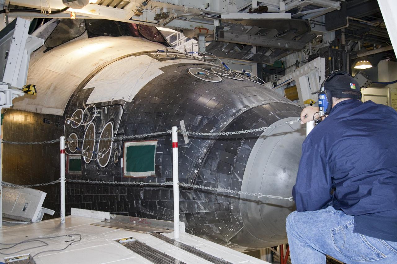 CAPE CANAVERAL, Fla. -- Technicians prepare shuttle Atlantis for its final planned move from Orbiter Processing Facility-1 to the Vehicle Assembly Building at NASA's Kennedy Space Center in Florida. The move called "rollover" is a major milestone in processing for the STS-135 mission to the International Space Station. Inside the VAB, the shuttle will be attached to its external fuel tank and solid rocket boosters. Commander Chris Ferguson, Pilot Doug Hurley and Mission Specialists Sandra Magnus and Rex Walheim are targeted to launch in early July, taking with them the Raffaello multipurpose logistics module packed with supplies, logistics and spare parts. The STS-135 mission also will fly a system to investigate the potential for robotically refueling existing spacecraft and return a failed ammonia pump module to help NASA better understand the failure mechanism and improve pump designs for future systems.                  STS-135 will be the 33rd flight of Atlantis, the 37th shuttle mission to the space station, and the 135th and final mission of NASA's Space Shuttle Program. For more information visit, www.nasa.gov/mission_pages/shuttle/shuttlemissions/sts135/index.html. Photo credit: NASA/Jack Pfaller