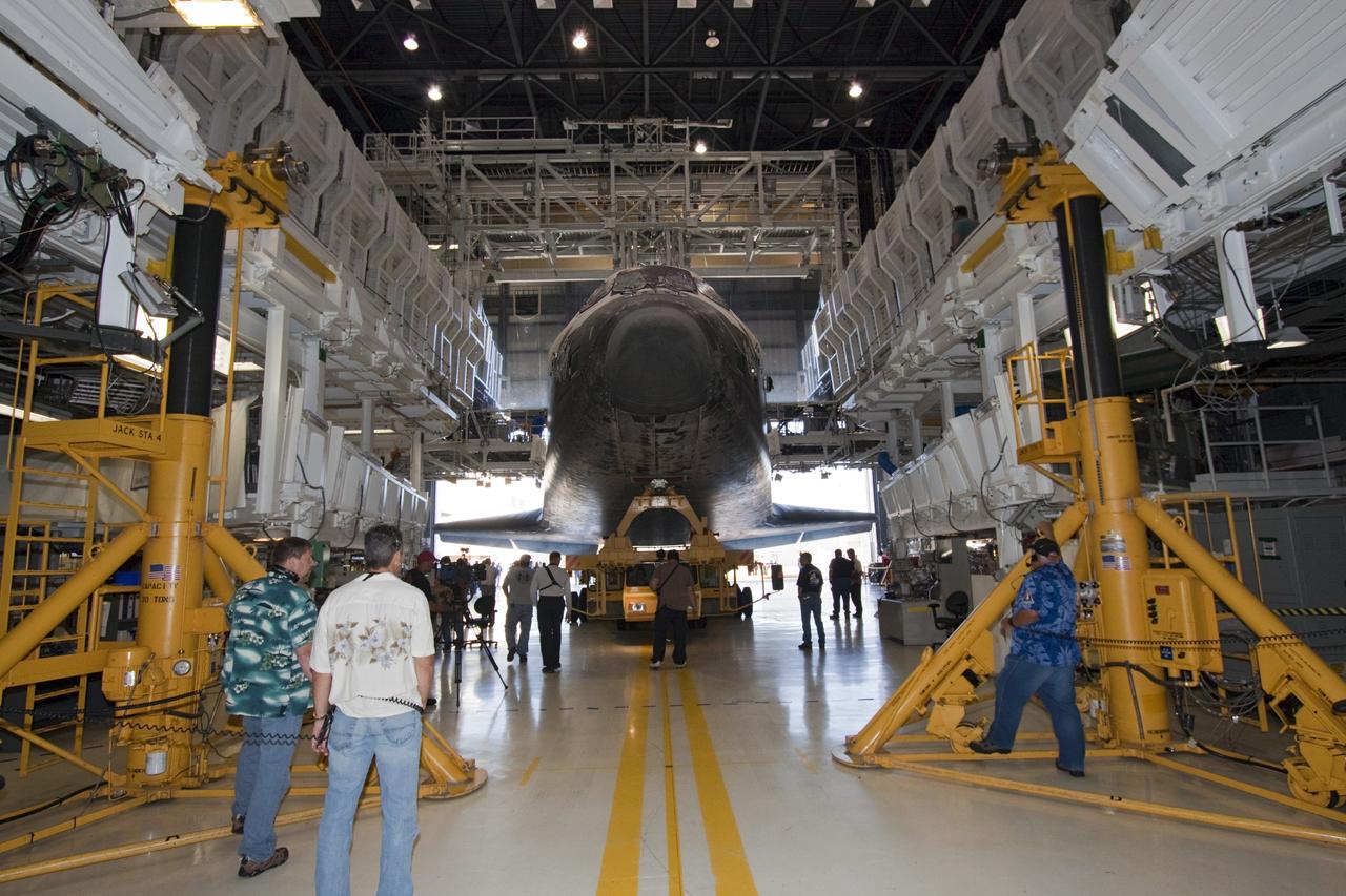 CAPE CANAVERAL, Fla. -- Technicians prepare shuttle Atlantis for its final planned move from Orbiter Processing Facility-1 to the Vehicle Assembly Building at NASA's Kennedy Space Center in Florida. The move called "rollover" is a major milestone in processing for the STS-135 mission to the International Space Station. Inside the VAB, the shuttle will be attached to its external fuel tank and solid rocket boosters. Commander Chris Ferguson, Pilot Doug Hurley and Mission Specialists Sandra Magnus and Rex Walheim are targeted to launch in early July, taking with them the Raffaello multipurpose logistics module packed with supplies, logistics and spare parts. The STS-135 mission also will fly a system to investigate the potential for robotically refueling existing spacecraft and return a failed ammonia pump module to help NASA better understand the failure mechanism and improve pump designs for future systems.            STS-135 will be the 33rd flight of Atlantis, the 37th shuttle mission to the space station, and the 135th and final mission of NASA's Space Shuttle Program. For more information visit, www.nasa.gov/mission_pages/shuttle/shuttlemissions/sts135/index.html. Photo credit: NASA/Jack Pfaller