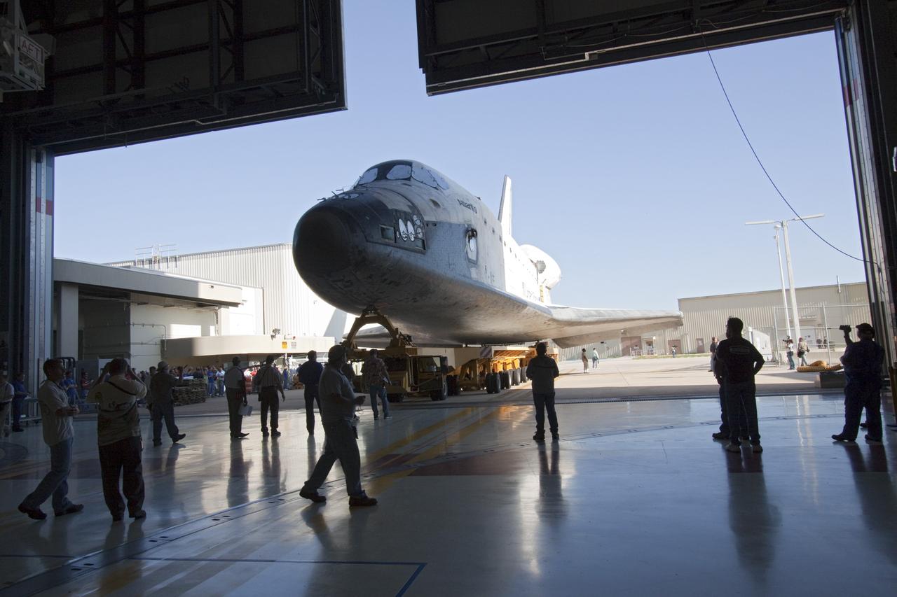 CAPE CANAVERAL, Fla. -- Shuttle Atlantis slowly backs out of Orbiter Processing Facility-1 during its final planned move to the Vehicle Assembly Building at NASA's Kennedy Space Center in Florida. The move called "rollover" is a major milestone in processing for the STS-135 mission to the International Space Station. Inside the VAB, the shuttle will be attached to its external fuel tank and solid rocket boosters. Commander Chris Ferguson, Pilot Doug Hurley and Mission Specialists Sandra Magnus and Rex Walheim are targeted to launch in early July, taking with them the Raffaello multipurpose logistics module packed with supplies, logistics and spare parts. The STS-135 mission also will fly a system to investigate the potential for robotically refueling existing spacecraft and return a failed ammonia pump module to help NASA better understand the failure mechanism and improve pump designs for future systems.        STS-135 will be the 33rd flight of Atlantis, the 37th shuttle mission to the space station, and the 135th and final mission of NASA's Space Shuttle Program. For more information visit, www.nasa.gov/mission_pages/shuttle/shuttlemissions/sts135/index.html. Photo credit: NASA/Jack Pfaller