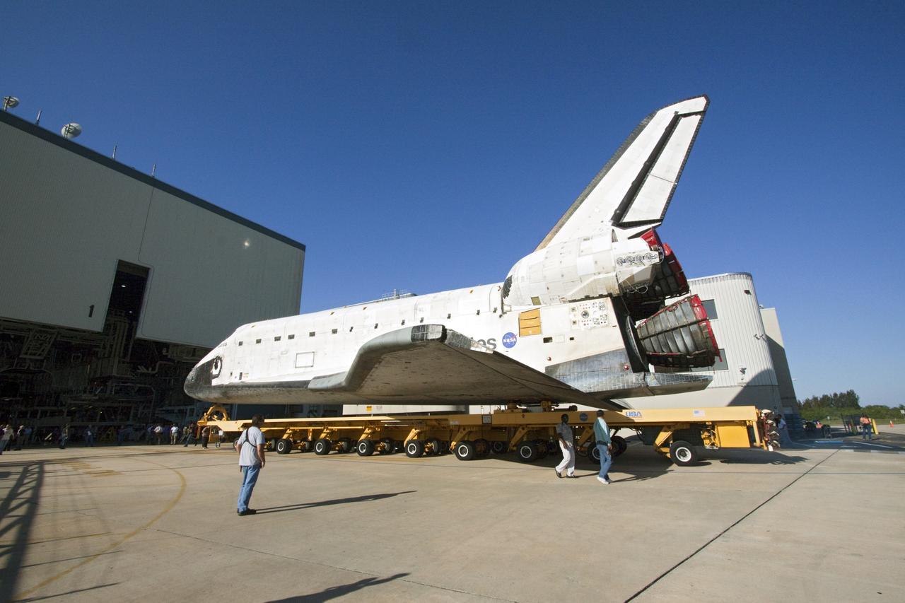 CAPE CANAVERAL, Fla. -- Shuttle Atlantis slowly backs out of Orbiter Processing Facility-1 during its final planned move to the Vehicle Assembly Building at NASA's Kennedy Space Center in Florida. The move called "rollover" is a major milestone in processing for the STS-135 mission to the International Space Station. Inside the VAB, the shuttle will be attached to its external fuel tank and solid rocket boosters. Commander Chris Ferguson, Pilot Doug Hurley and Mission Specialists Sandra Magnus and Rex Walheim are targeted to launch in early July, taking with them the Raffaello multipurpose logistics module packed with supplies, logistics and spare parts. The STS-135 mission also will fly a system to investigate the potential for robotically refueling existing spacecraft and return a failed ammonia pump module to help NASA better understand the failure mechanism and improve pump designs for future systems.      STS-135 will be the 33rd flight of Atlantis, the 37th shuttle mission to the space station, and the 135th and final mission of NASA's Space Shuttle Program. For more information visit, www.nasa.gov/mission_pages/shuttle/shuttlemissions/sts135/index.html. Photo credit: NASA/Jack Pfaller