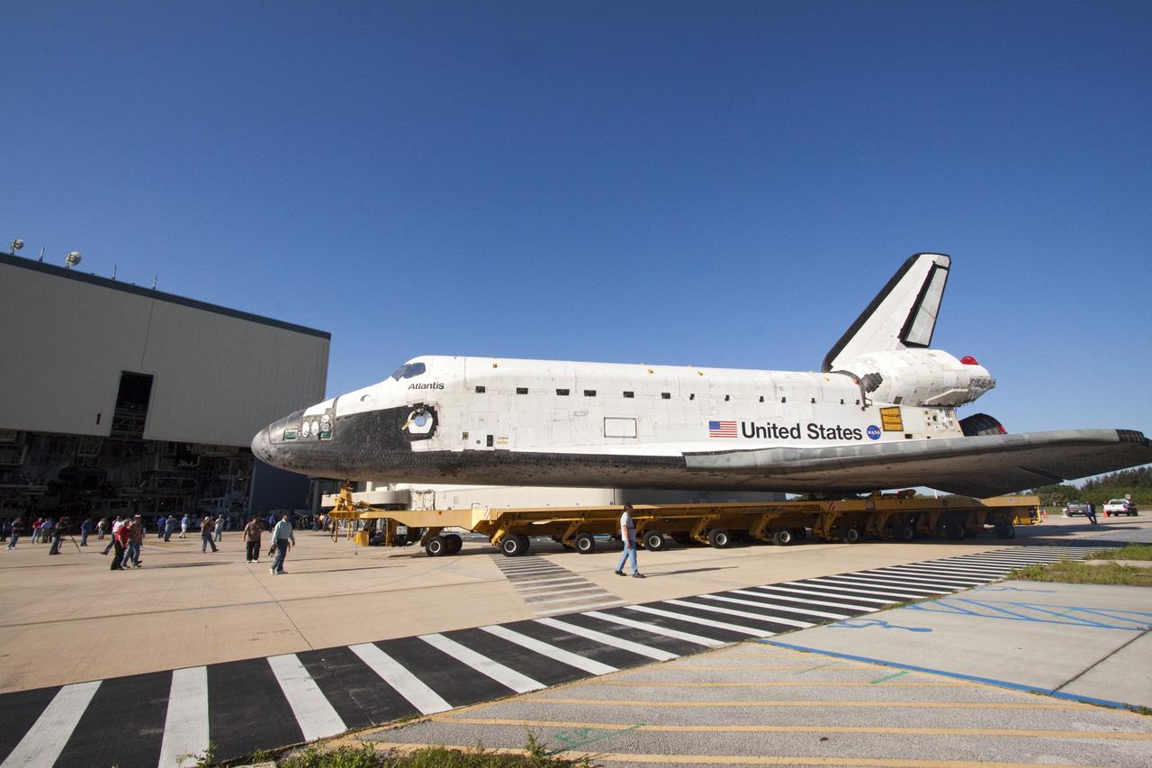CAPE CANAVERAL, Fla. -- Shuttle Atlantis makes its final planned move from Orbiter Processing Facility-1 to the Vehicle Assembly Building at NASA's Kennedy Space Center in Florida. The move called "rollover" is a major milestone in processing for the STS-135 mission to the International Space Station. Inside the VAB, the shuttle will be attached to its external fuel tank and solid rocket boosters. Commander Chris Ferguson, Pilot Doug Hurley and Mission Specialists Sandra Magnus and Rex Walheim are targeted to launch in early July, taking with them the Raffaello multipurpose logistics module packed with supplies, logistics and spare parts. The STS-135 mission also will fly a system to investigate the potential for robotically refueling existing spacecraft and return a failed ammonia pump module to help NASA better understand the failure mechanism and improve pump designs for future systems.      STS-135 will be the 33rd flight of Atlantis, the 37th shuttle mission to the space station, and the 135th and final mission of NASA's Space Shuttle Program. For more information visit, www.nasa.gov/mission_pages/shuttle/shuttlemissions/sts135/index.html. Photo credit: NASA/Jack Pfaller