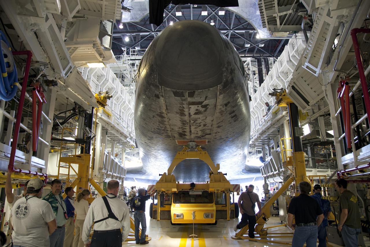 CAPE CANAVERAL, Fla. -- Technicians prepare shuttle Atlantis for its final planned move from Orbiter Processing Facility-1 to the Vehicle Assembly Building (VAB) at NASA's Kennedy Space Center in Florida.               The move called "rollover" is a major milestone in processing for the STS-135 mission to the International Space Station. Inside the VAB, the shuttle will be attached to its external fuel tank and solid rocket boosters. Commander Chris Ferguson, Pilot Doug Hurley and Mission Specialists Sandra Magnus and Rex Walheim are targeted to launch in early July, taking with them the Raffaello multipurpose logistics module packed with supplies, logistics and spare parts. The STS-135 mission also will fly a system to investigate the potential for robotically refueling existing spacecraft and return a failed ammonia pump module to help NASA better understand the failure mechanism and improve pump designs for future systems. STS-135 will be the 33rd flight of Atlantis, the 37th shuttle mission to the space station, and the 135th and final mission of NASA's Space Shuttle Program. For more information visit, www.nasa.gov/mission_pages/shuttle/shuttlemissions/sts135/index.html. Photo credit: NASA/Frankie Martin