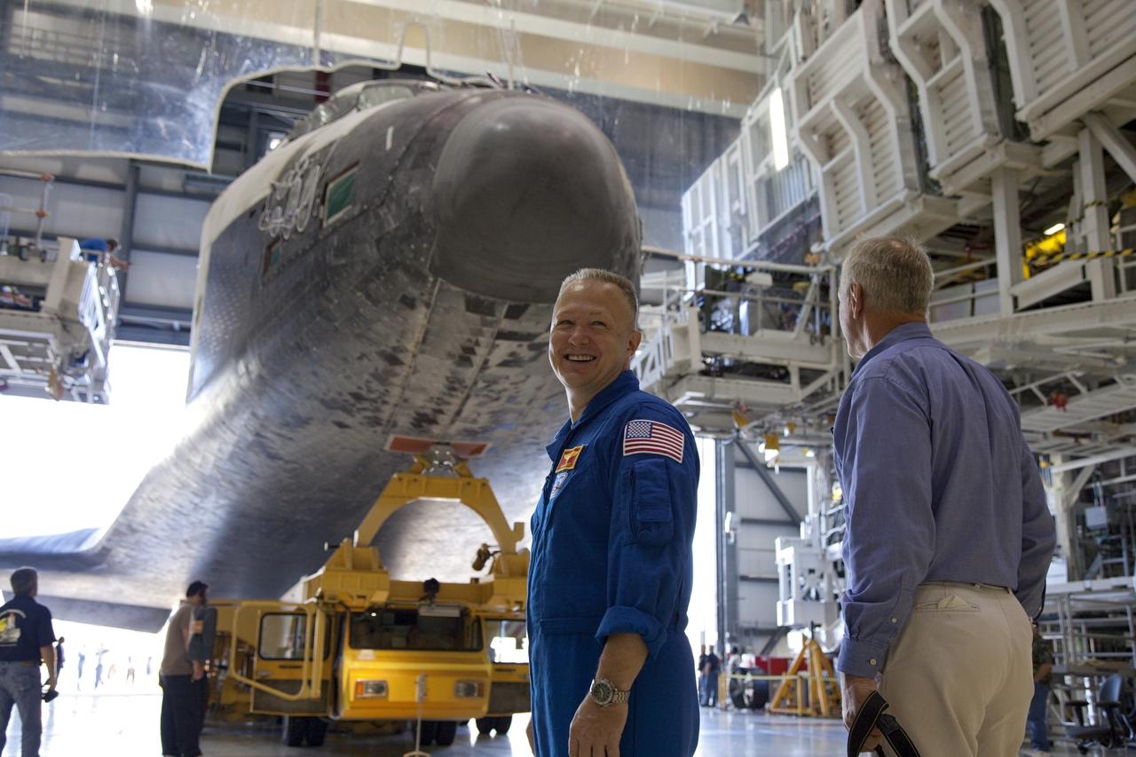 CAPE CANAVERAL, Fla. -- In Orbiter Processing Facility-1 at NASA's Kennedy Space Center in Florida, STS-135 Pilot Doug Hurley is on hand to watch Atlantis' rollover from Orbiter Processing Facility-1 to the Vehicle Assembly Building (VAB) at NASA's Kennedy Space Center in Florida.            The move called "rollover" is a major milestone in processing for the STS-135 mission to the International Space Station. Inside the VAB, the shuttle will be attached to its external fuel tank and solid rocket boosters. Commander Chris Ferguson, Pilot Doug Hurley and Mission Specialists Sandra Magnus and Rex Walheim are targeted to launch in early July, taking with them the Raffaello multipurpose logistics module packed with supplies, logistics and spare parts. The STS-135 mission also will fly a system to investigate the potential for robotically refueling existing spacecraft and return a failed ammonia pump module to help NASA better understand the failure mechanism and improve pump designs for future systems. STS-135 will be the 33rd flight of Atlantis, the 37th shuttle mission to the space station, and the 135th and final mission of NASA's Space Shuttle Program. For more information visit, www.nasa.gov/mission_pages/shuttle/shuttlemissions/sts135/index.html. Photo credit: NASA/Frankie Martin