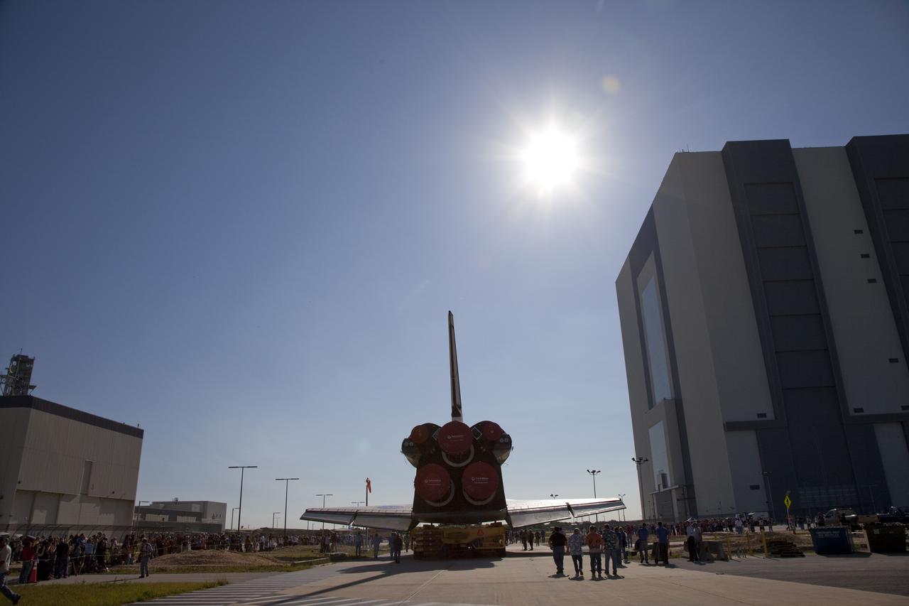CAPE CANAVERAL, Fla. -- A hazy Florida sun shines down on NASA's Kennedy Space Center as shuttle Atlantis makes its final planned move from Orbiter Processing Facility-1 to the Vehicle Assembly Building (VAB).            The move called "rollover" is a major milestone in processing for the STS-135 mission to the International Space Station. Inside the VAB, the shuttle will be attached to its external fuel tank and solid rocket boosters. Commander Chris Ferguson, Pilot Doug Hurley and Mission Specialists Sandra Magnus and Rex Walheim are targeted to launch in early July, taking with them the Raffaello multipurpose logistics module packed with supplies, logistics and spare parts. The STS-135 mission also will fly a system to investigate the potential for robotically refueling existing spacecraft and return a failed ammonia pump module to help NASA better understand the failure mechanism and improve pump designs for future systems. STS-135 will be the 33rd flight of Atlantis, the 37th shuttle mission to the space station, and the 135th and final mission of NASA's Space Shuttle Program. For more information visit, www.nasa.gov/mission_pages/shuttle/shuttlemissions/sts135/index.html. Photo credit: NASA/Frankie Martin