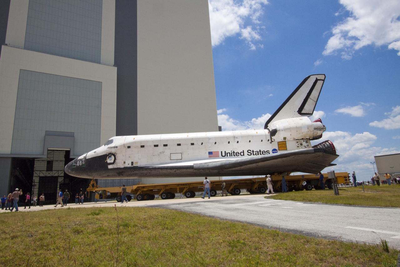 CAPE CANAVERAL, Fla. -- Shuttle Atlantis makes its final planned move, or rollover, into the Vehicle Assembly Building (VAB) from Orbiter Processing Facility-1 at NASA's Kennedy Space Center in Florida.          The move called "rollover" is a major milestone in processing for the STS-135 mission to the International Space Station. Commander Chris Ferguson, Pilot Doug Hurley and Mission Specialists Sandra Magnus and Rex Walheim are expected to launch mid July, taking with them the Raffaello multipurpose logistics module packed with supplies, logistics and spare parts. The STS-135 mission also will fly a system to investigate the potential for robotically refueling existing spacecraft and return a failed ammonia pump module to help NASA better understand the failure mechanism and improve pump designs for future systems. STS-135 will be the 33rd flight of Atlantis, the 37th shuttle mission to the space station, and the 135th and final mission of NASA's Space Shuttle Program. For more information visit, www.nasa.gov/mission_pages/shuttle/shuttlemissions/sts135/index.html. Photo credit: NASA/Jack Pfaller