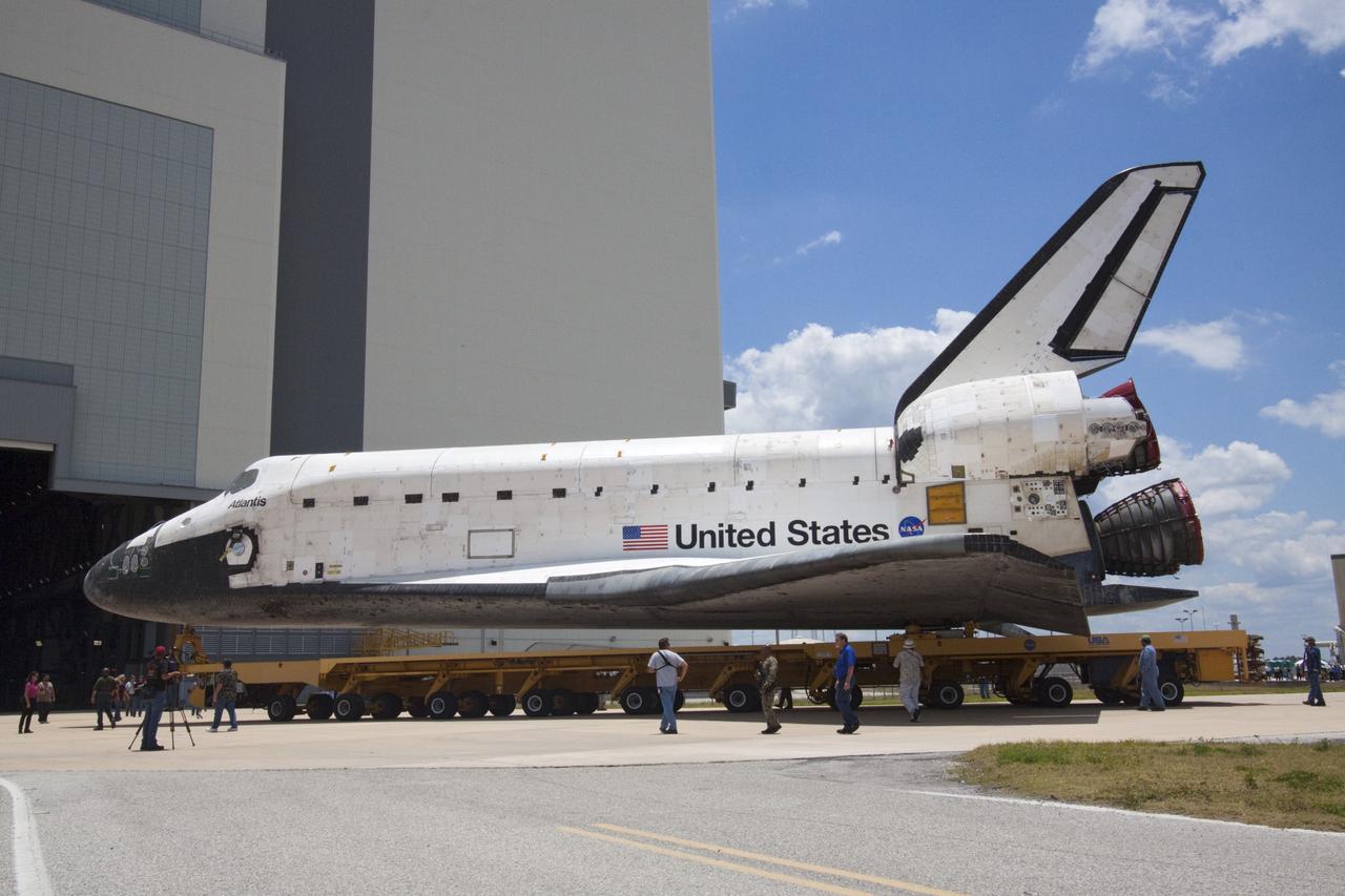 CAPE CANAVERAL, Fla. -- Shuttle Atlantis makes its final planned move, or rollover, into the Vehicle Assembly Building (VAB) from Orbiter Processing Facility-1 at NASA's Kennedy Space Center in Florida.      The move called "rollover" is a major milestone in processing for the STS-135 mission to the International Space Station. Commander Chris Ferguson, Pilot Doug Hurley and Mission Specialists Sandra Magnus and Rex Walheim are expected to launch mid July, taking with them the Raffaello multipurpose logistics module packed with supplies, logistics and spare parts. The STS-135 mission also will fly a system to investigate the potential for robotically refueling existing spacecraft and return a failed ammonia pump module to help NASA better understand the failure mechanism and improve pump designs for future systems. STS-135 will be the 33rd flight of Atlantis, the 37th shuttle mission to the space station, and the 135th and final mission of NASA's Space Shuttle Program. For more information visit, www.nasa.gov/mission_pages/shuttle/shuttlemissions/sts135/index.html. Photo credit: NASA/Jack Pfaller