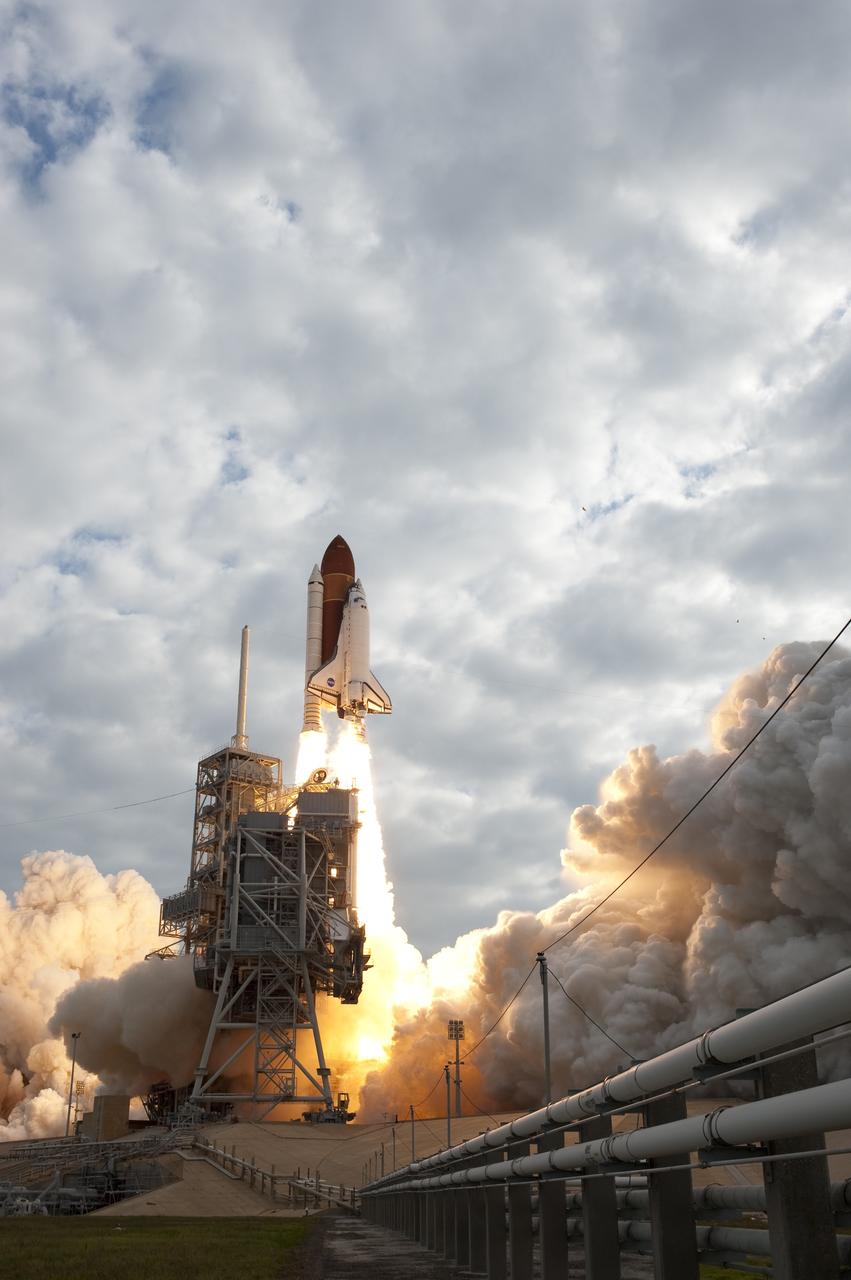 CAPE CANAVERAL, Fla. -- Rising on twin columns of fire, space shuttle Endeavour clears the tower during liftoff from Launch Pad 39A at NASA's Kennedy Space Center in Florida.      Endeavour began its final flight, the STS-134 mission to the International Space Station, at 8:56 a.m. EDT on May 16. Endeavour and its six-member crew will deliver the Alpha Magnetic Spectrometer-2 (AMS), Express Logistics Carrier-3, a high-pressure gas tank and additional spare parts for the Dextre robotic helper to the space station. For more information visit, www.nasa.gov/mission_pages/shuttle/shuttlemissions/sts134/index.html. Photo credit: NASA/Sandra Joseph and Kevin O'Connell