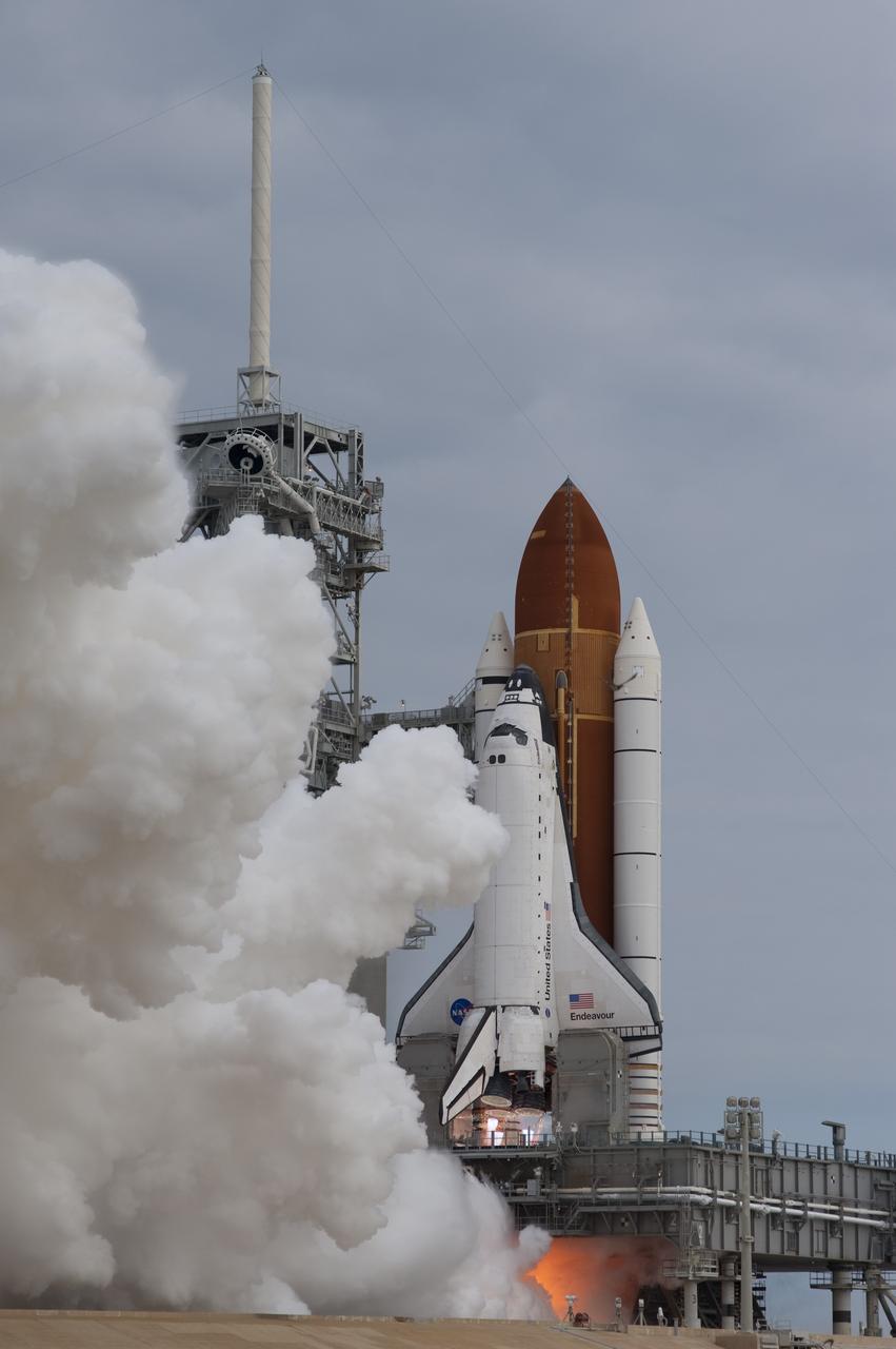 CAPE CANAVERAL, Fla. -- A cloud of steam and smoke emerge as space shuttle Endeavour's main engines ignite for liftoff at Launch Pad 39A at NASA's Kennedy Space Center in Florida. Endeavour began its final flight, the STS-134 mission to the International Space Station, at 8:56 a.m. EDT on May 16. Endeavour and its six-member crew will deliver the Alpha Magnetic Spectrometer-2 (AMS), Express Logistics Carrier-3, a high-pressure gas tank and additional spare parts for the Dextre robotic helper to the space station. For more information visit, www.nasa.gov/mission_pages/shuttle/shuttlemissions/sts134/index.html. Photo credit: NASA/Sandra Joseph and Kevin O'Connell