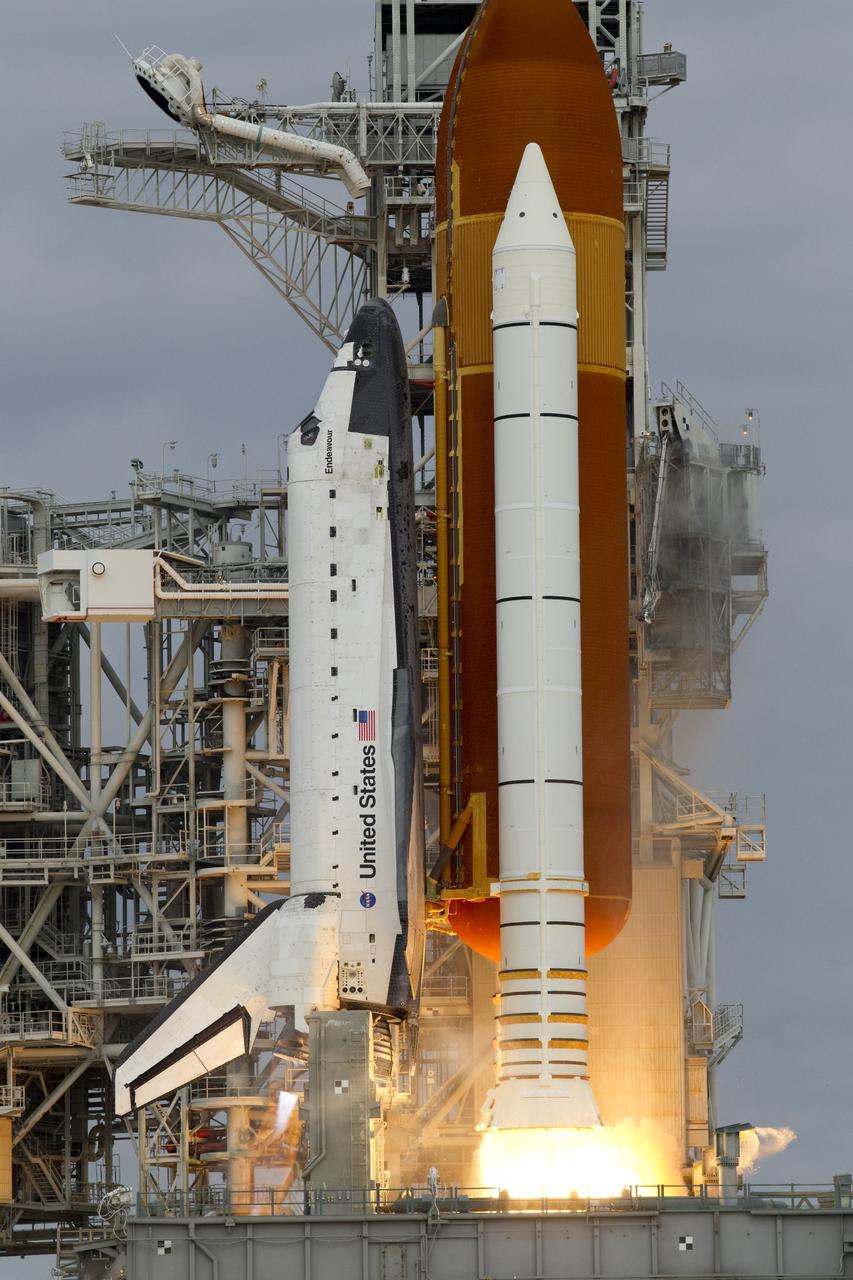 CAPE CANAVERAL, Fla. -- Space shuttle Endeavour's main engines and solid rocket boosters burst into life lifting the shuttle from Launch Pad 39A at NASA's Kennedy Space Center in Florida. Endeavour began its final flight, the STS-134 mission to the International Space Station, at 8:56 a.m. EDT on May 16. Endeavour and its six-member crew will deliver the Alpha Magnetic Spectrometer-2 (AMS), Express Logistics Carrier-3, a high-pressure gas tank and additional spare parts for the Dextre robotic helper to the space station. For more information visit, www.nasa.gov/mission_pages/shuttle/shuttlemissions/sts134/index.html. Photo credit: NASA/George Roberts and Mike Kerley