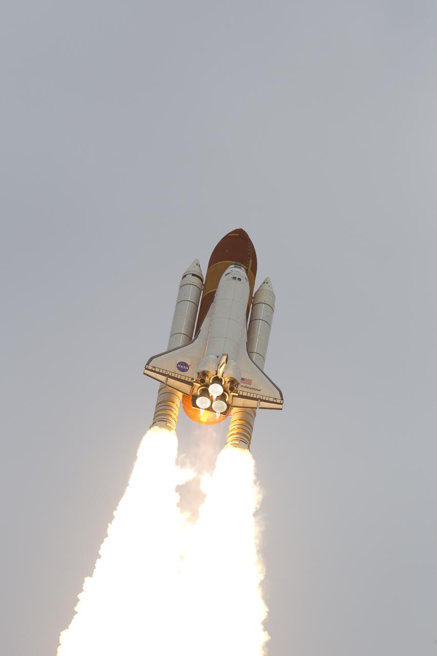 CAPE CANAVERAL, Fla. -- Space shuttle Endeavour riding a twin column of fire races into space after lifting off from Launch Pad 39A at NASA's Kennedy Space Center in Florida.      Endeavour began its final flight, the STS-134 mission to the International Space Station, at 8:56 a.m. EDT on May 16. Endeavour and its six-member crew will deliver the Alpha Magnetic Spectrometer-2 (AMS), Express Logistics Carrier-3, a high-pressure gas tank and additional spare parts for the Dextre robotic helper to the space station. For more information visit, www.nasa.gov/mission_pages/shuttle/shuttlemissions/sts134/index.html. Photo credit: NASA/George Roberts and Mike Kerley