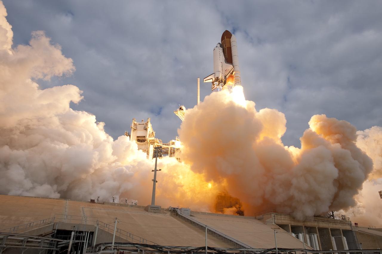 CAPE CANAVERAL, Fla. -- Space shuttle Endeavour rises through clouds of smoke and steam from Launch Pad 39A at NASA's Kennedy Space Center in Florida. Endeavour began its final flight, the STS-134 mission to the International Space Station, at 8:56 a.m. EDT on May 16. Endeavour and its six-member crew will deliver the Alpha Magnetic Spectrometer-2 (AMS), Express Logistics Carrier-3, a high-pressure gas tank and additional spare parts for the Dextre robotic helper to the space station. For more information visit, www.nasa.gov/mission_pages/shuttle/shuttlemissions/sts134/index.html. Photo credit: NASA/Sandra Joseph and Kevin O'Connell