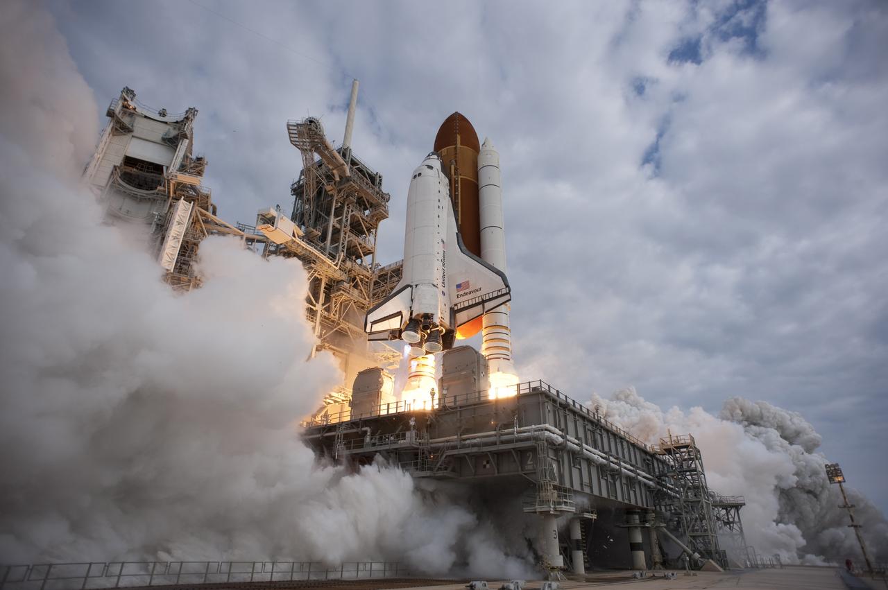 CAPE CANAVERAL, Fla. -- Space shuttle Endeavour rises on twin columns of flame from Launch Pad 39A at NASA's Kennedy Space Center in Florida.    Endeavour began its final flight, the STS-134 mission to the International Space Station, at 8:56 a.m. EDT on May 16. Endeavour and its six-member crew will deliver the Alpha Magnetic Spectrometer-2 (AMS), Express Logistics Carrier-3, a high-pressure gas tank and additional spare parts for the Dextre robotic helper to the space station. For more information visit, www.nasa.gov/mission_pages/shuttle/shuttlemissions/sts134/index.html. Photo credit: NASA/Tony Gray and Tom Farrar