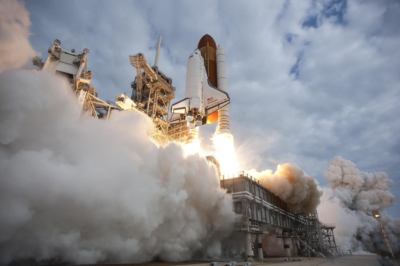 CAPE CANAVERAL, Fla. -- Space shuttle Endeavour rises on twin columns of flame from Launch Pad 39A at NASA's Kennedy Space Center in Florida.    Endeavour began its final flight, the STS-134 mission to the International Space Station, at 8:56 a.m. EDT on May 16. Endeavour and its six-member crew will deliver the Alpha Magnetic Spectrometer-2 (AMS), Express Logistics Carrier-3, a high-pressure gas tank and additional spare parts for the Dextre robotic helper to the space station. For more information visit, www.nasa.gov/mission_pages/shuttle/shuttlemissions/sts134/index.html. Photo credit: NASA/Tony Gray and Tom Farrar