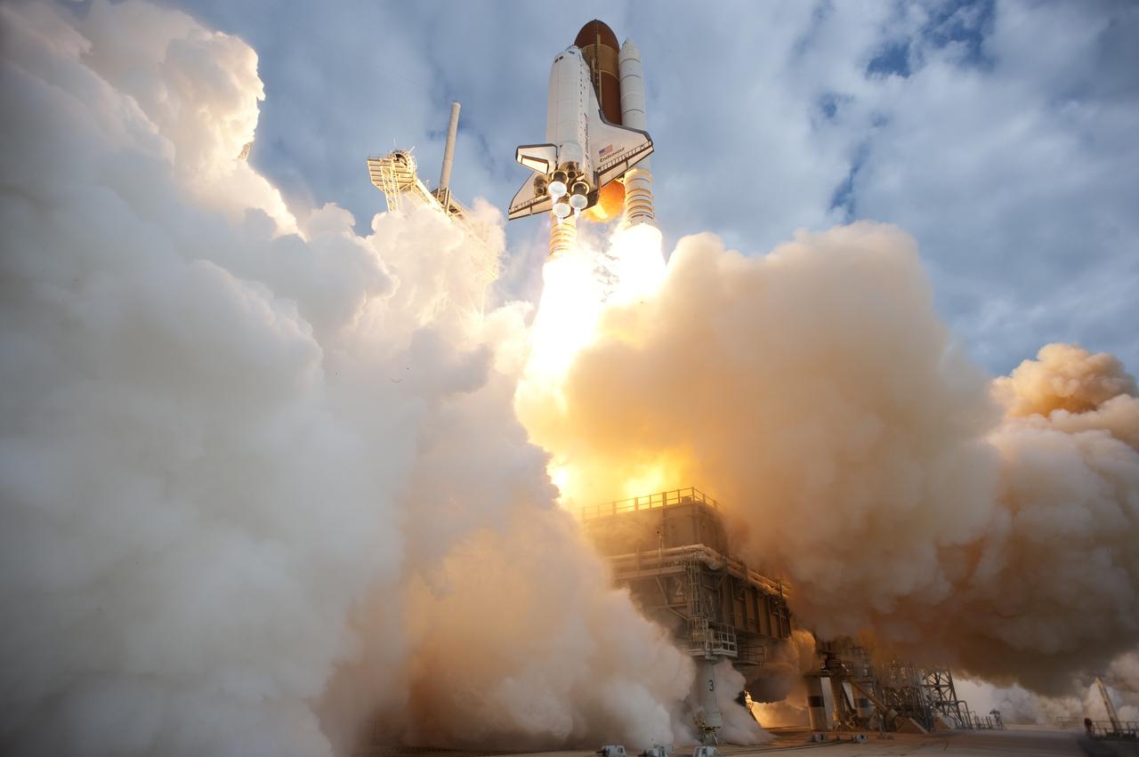 CAPE CANAVERAL, Fla. -- Space shuttle Endeavour rises on twin columns of flame through clouds of smoke and steam from Launch Pad 39A at NASA's Kennedy Space Center in Florida.      Endeavour began its final flight, the STS-134 mission to the International Space Station, at 8:56 a.m. EDT on May 16. Endeavour and its six-member crew will deliver the Alpha Magnetic Spectrometer-2 (AMS), Express Logistics Carrier-3, a high-pressure gas tank and additional spare parts for the Dextre robotic helper to the space station. For more information visit, www.nasa.gov/mission_pages/shuttle/shuttlemissions/sts134/index.html. Photo credit: NASA/Tony Gray and Tom Farrar