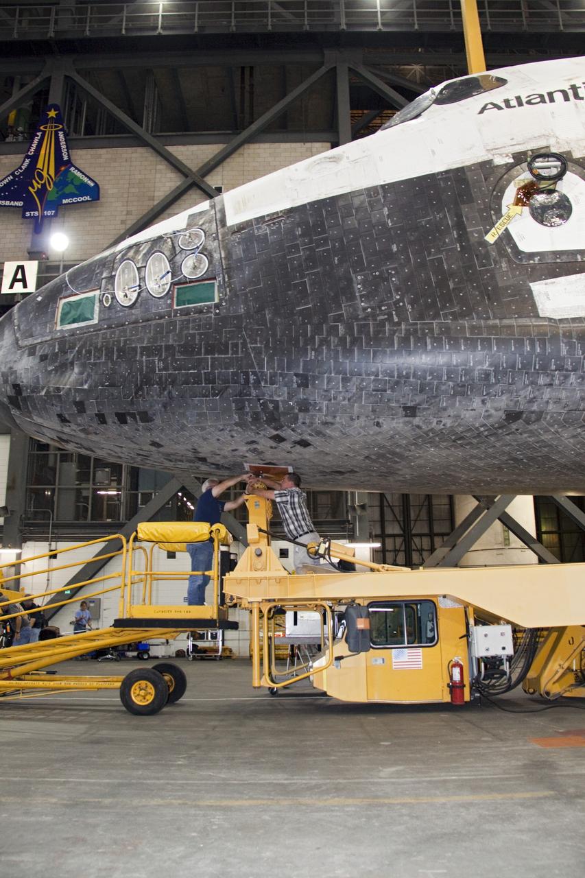 CAPE CANAVERAL, Fla. -- In the Vehicle Assembly Building at NASA's Kennedy Space Center in Florida, workers disconnect the transporter from shuttle Atlantis. An overhead crane then will lift the spacecraft into a high bay where it will be attached to its external fuel tank and solid rocket boosters already on the mobile launcher platform. Commander Chris Ferguson, Pilot Doug Hurley and Mission Specialists Sandra Magnus and Rex Walheim are expected to launch in mid-July, taking with them the Raffaello multi-purpose logistics module packed with supplies, logistics and spare parts. The STS-135 mission also will fly a system to investigate the potential for robotically refueling existing spacecraft and return a failed ammonia pump module to help NASA better understand the failure mechanism and improve pump designs for future systems. STS-135 will be the 33rd flight of Atlantis, the 37th shuttle mission to the space station, and the 135th and final mission of NASA's Space Shuttle Program. For more information visit, www.nasa.gov/mission_pages/shuttle/shuttlemissions/sts135/index.html. Photo credit: NASA/Jack Pfaller