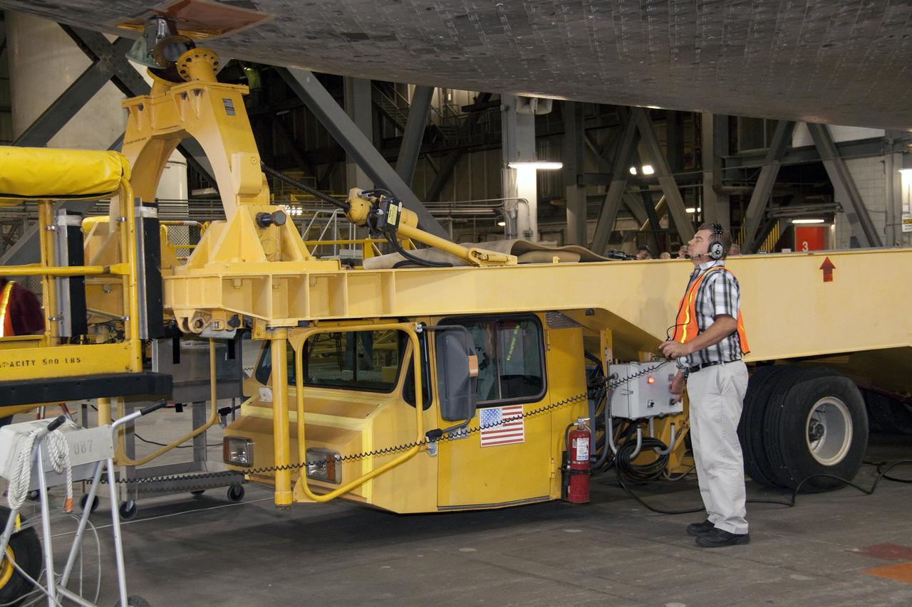 CAPE CANAVERAL, Fla. -- In the Vehicle Assembly Building at NASA's Kennedy Space Center in Florida, workers disconnect the transporter from shuttle Atlantis. An overhead crane then will lift the spacecraft into a high bay where it will be attached to its external fuel tank and solid rocket boosters already on the mobile launcher platform. Commander Chris Ferguson, Pilot Doug Hurley and Mission Specialists Sandra Magnus and Rex Walheim are expected to launch in mid-July, taking with them the Raffaello multi-purpose logistics module packed with supplies, logistics and spare parts. The STS-135 mission also will fly a system to investigate the potential for robotically refueling existing spacecraft and return a failed ammonia pump module to help NASA better understand the failure mechanism and improve pump designs for future systems. STS-135 will be the 33rd flight of Atlantis, the 37th shuttle mission to the space station, and the 135th and final mission of NASA's Space Shuttle Program. For more information visit, www.nasa.gov/mission_pages/shuttle/shuttlemissions/sts135/index.html. Photo credit: NASA/Jack Pfaller