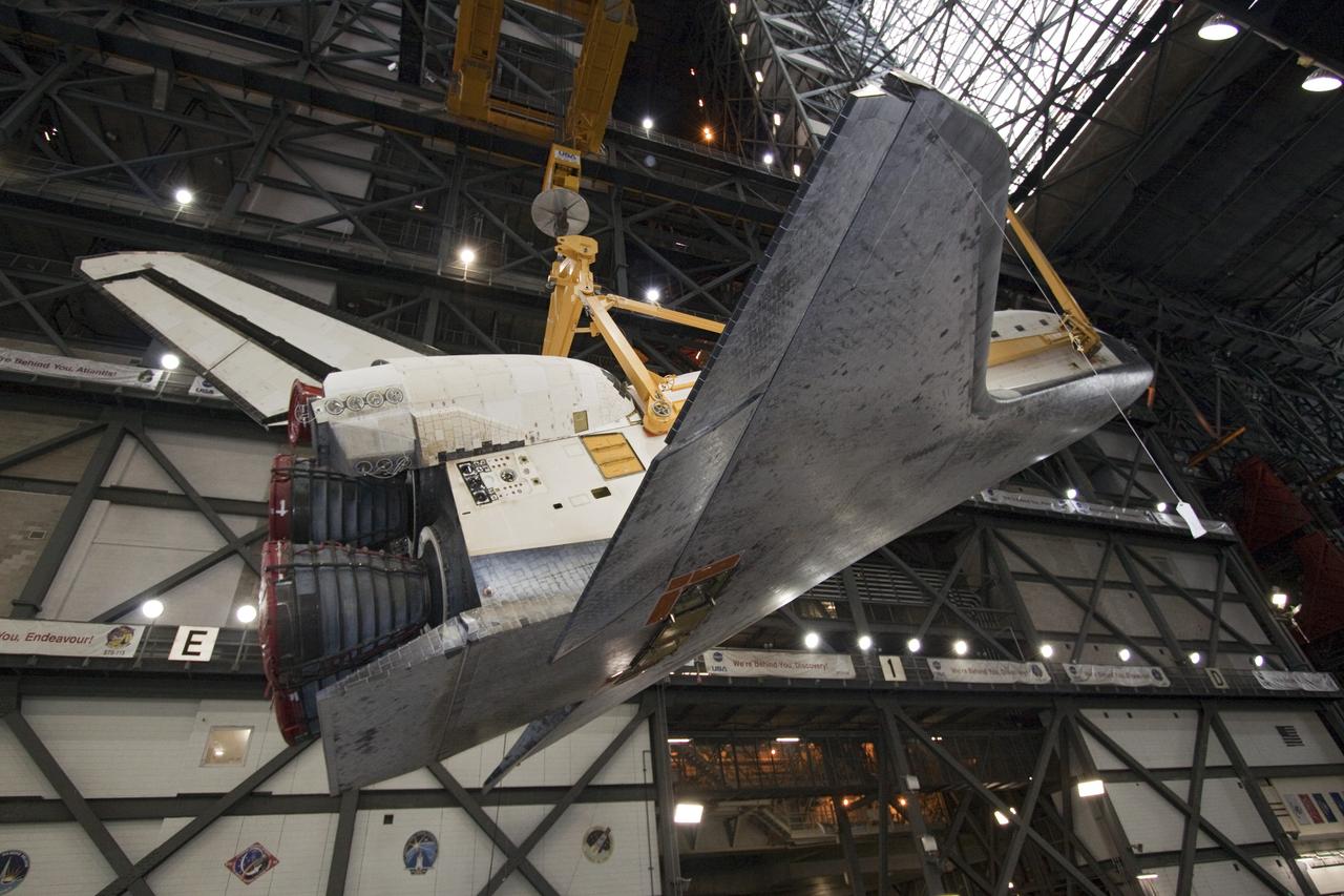 CAPE CANAVERAL, Fla. -- In Vehicle Assembly Building at NASA's Kennedy Space Center in Florida, an overhead crane slowly lifts shuttle Atlantis into a vertical position above the transfer aisle. The spacecraft will be moved to a high bay where it will be attached to its external fuel tank and solid rocket boosters already on the mobile launcher platform. Commander Chris Ferguson, Pilot Doug Hurley and Mission Specialists Sandra Magnus and Rex Walheim are expected to launch in mid-July, taking with them the Raffaello multi-purpose logistics module packed with supplies, logistics and spare parts. The STS-135 mission also will fly a system to investigate the potential for robotically refueling existing spacecraft and return a failed ammonia pump module to help NASA better understand the failure mechanism and improve pump designs for future systems. STS-135 will be the 33rd flight of Atlantis, the 37th shuttle mission to the space station, and the 135th and final mission of NASA's Space Shuttle Program. For more information visit, www.nasa.gov/mission_pages/shuttle/shuttlemissions/sts135/index.html. Photo credit: NASA/Jack Pfaller