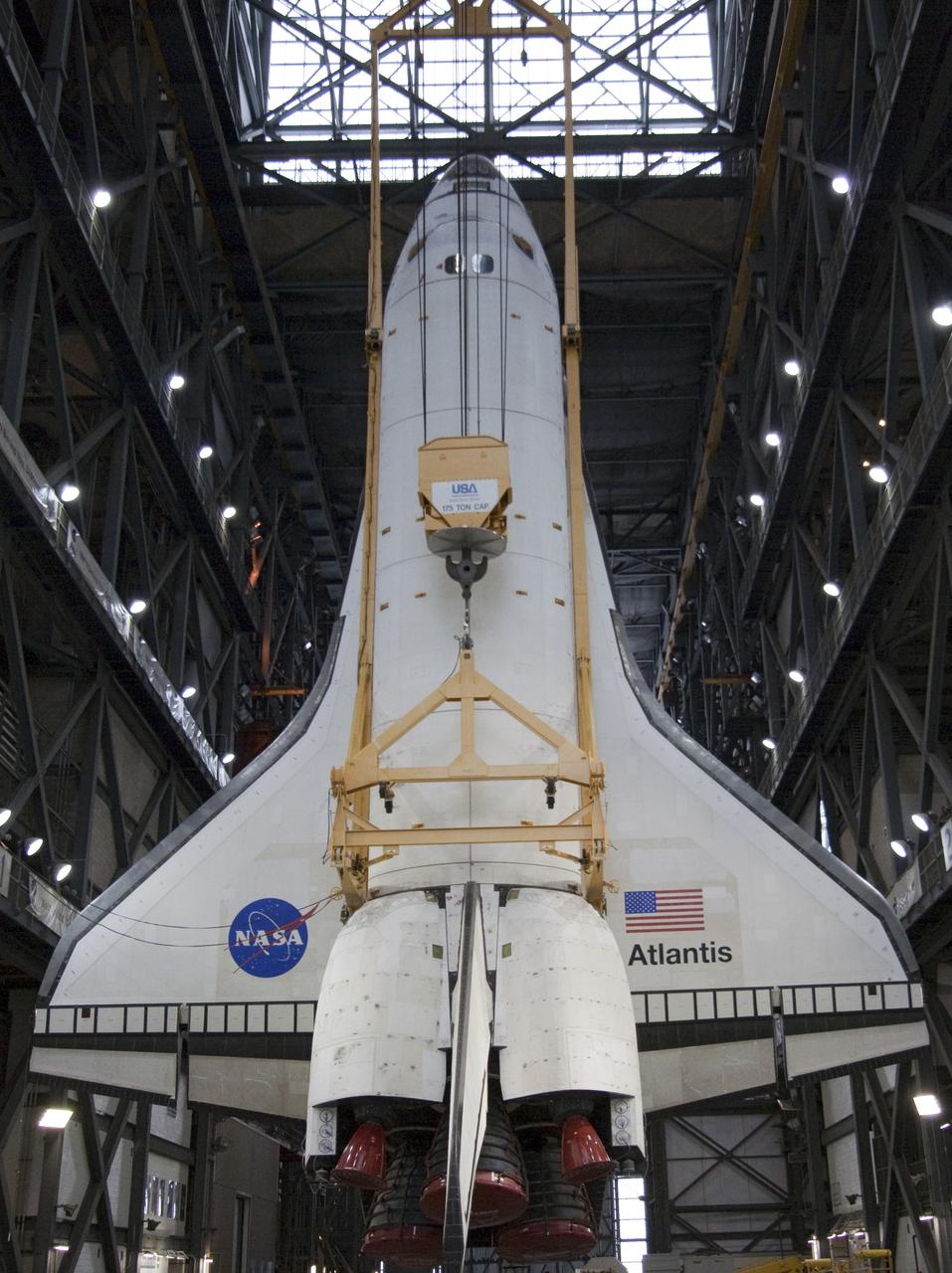 CAPE CANAVERAL, Fla. -- In Vehicle Assembly Building at NASA's Kennedy Space Center in Florida, an overhead crane suspends shuttle Atlantis above the transfer aisle. The spacecraft will be moved into a high bay where it will be lowered and attached to its external fuel tank and solid rocket boosters already on the mobile launcher platform. Commander Chris Ferguson, Pilot Doug Hurley and Mission Specialists Sandra Magnus and Rex Walheim are expected to launch in mid-July, taking with them the Raffaello multi-purpose logistics module packed with supplies, logistics and spare parts. The STS-135 mission also will fly a system to investigate the potential for robotically refueling existing spacecraft and return a failed ammonia pump module to help NASA better understand the failure mechanism and improve pump designs for future systems. STS-135 will be the 33rd flight of Atlantis, the 37th shuttle mission to the space station, and the 135th and final mission of NASA's Space Shuttle Program. For more information visit, www.nasa.gov/mission_pages/shuttle/shuttlemissions/sts135/index.html. Photo credit: NASA/Jack Pfaller