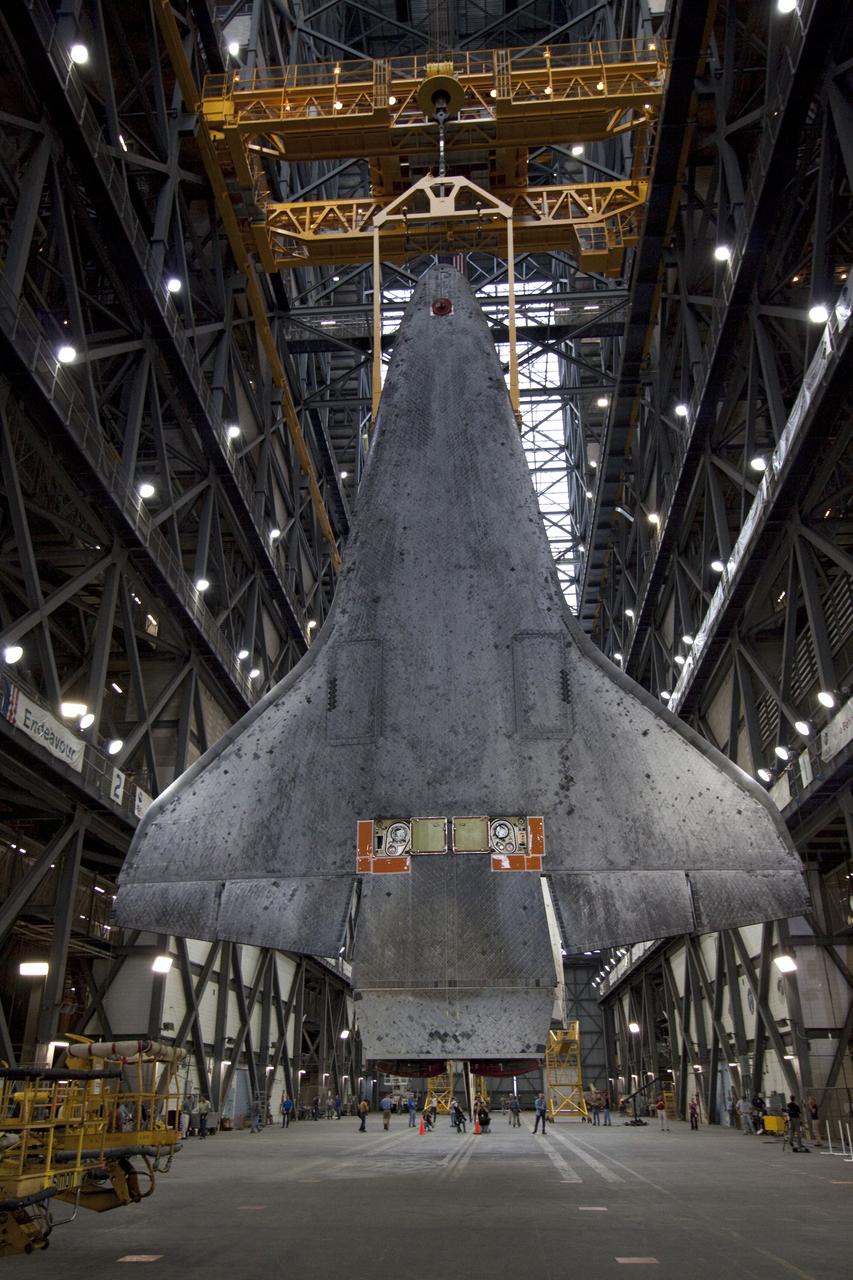 CAPE CANAVERAL, Fla. -- In Vehicle Assembly Building at NASA's Kennedy Space Center in Florida, an overhead crane suspends shuttle Atlantis above the transfer aisle. The spacecraft will be moved into a high bay where it will be lowered and attached to its external fuel tank and solid rocket boosters already on the mobile launcher platform. Commander Chris Ferguson, Pilot Doug Hurley and Mission Specialists Sandra Magnus and Rex Walheim are expected to launch in mid-July, taking with them the Raffaello multi-purpose logistics module packed with supplies, logistics and spare parts. The STS-135 mission also will fly a system to investigate the potential for robotically refueling existing spacecraft and return a failed ammonia pump module to help NASA better understand the failure mechanism and improve pump designs for future systems. STS-135 will be the 33rd flight of Atlantis, the 37th shuttle mission to the space station, and the 135th and final mission of NASA's Space Shuttle Program. For more information visit, www.nasa.gov/mission_pages/shuttle/shuttlemissions/sts135/index.html. Photo credit: NASA/Jack Pfaller