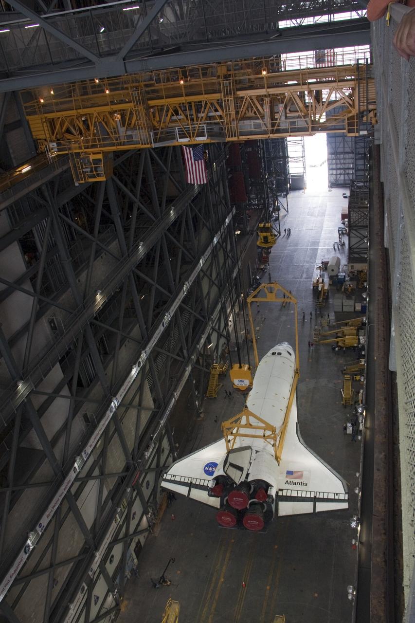 CAPE CANAVERAL, Fla. -- In the Vehicle Assembly Building at NASA's Kennedy Space Center in Florida, shuttle Atlantis is suspended over the transfer aisle by an overhead crane. Atlantis then will be lifted vertically and moved into a high bay where it will be attached to its external fuel tank and solid rocket boosters already on the mobile launcher platform. Commander Chris Ferguson, Pilot Doug Hurley and Mission Specialists Sandra Magnus and Rex Walheim are expected to launch in mid-July, taking with them the Raffaello multi-purpose logistics module packed with supplies, logistics and spare parts. The STS-135 mission also will fly a system to investigate the potential for robotically refueling existing spacecraft and return a failed ammonia pump module to help NASA better understand the failure mechanism and improve pump designs for future systems. STS-135 will be the 33rd flight of Atlantis, the 37th shuttle mission to the space station, and the 135th and final mission of NASA's Space Shuttle Program. For more information visit, www.nasa.gov/mission_pages/shuttle/shuttlemissions/sts135/index.html. Photo credit: NASA/Ken Thornsley