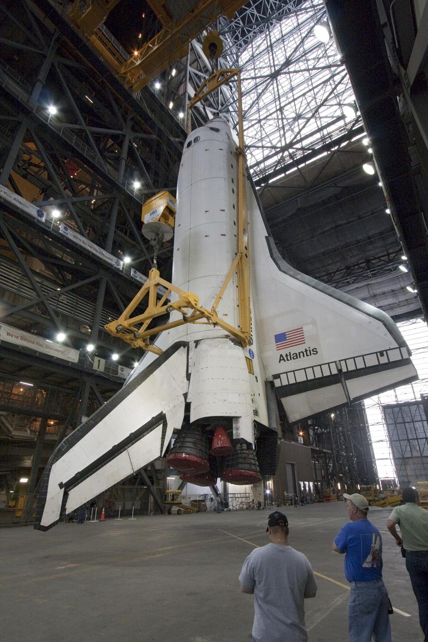 CAPE CANAVERAL, Fla. -- In Vehicle Assembly Building at NASA's Kennedy Space Center in Florida, an overhead crane suspends shuttle Atlantis above the transfer aisle. The spacecraft then will be moved into a high bay where it will be lowered and attached to its external fuel tank and solid rocket boosters already on the mobile launcher platform. Commander Chris Ferguson, Pilot Doug Hurley and Mission Specialists Sandra Magnus and Rex Walheim are expected to launch in mid-July, taking with them the Raffaello multi-purpose logistics module packed with supplies, logistics and spare parts. The STS-135 mission also will fly a system to investigate the potential for robotically refueling existing spacecraft and return a failed ammonia pump module to help NASA better understand the failure mechanism and improve pump designs for future systems. STS-135 will be the 33rd flight of Atlantis, the 37th shuttle mission to the space station, and the 135th and final mission of NASA's Space Shuttle Program. For more information visit, www.nasa.gov/mission_pages/shuttle/shuttlemissions/sts135/index.html. Photo credit: NASA/Ken Thornsley