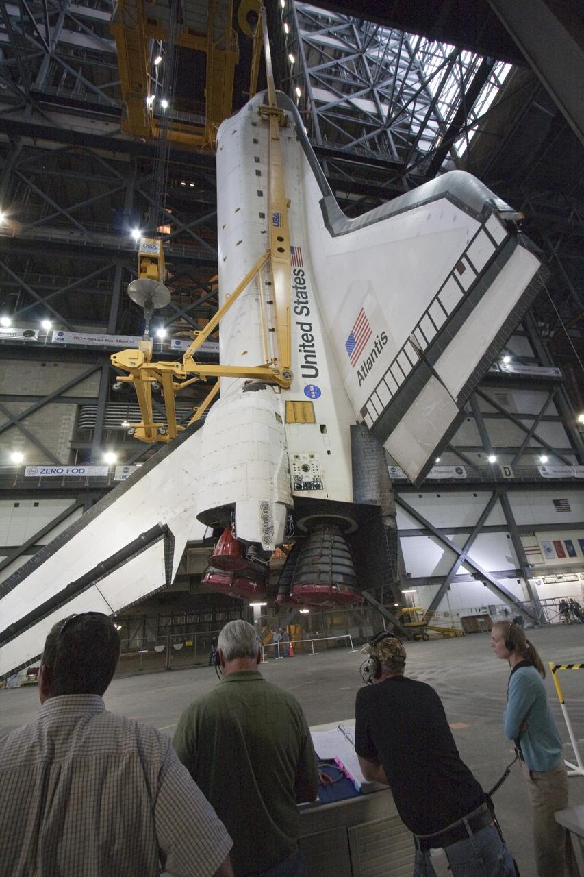 CAPE CANAVERAL, Fla. -- In Vehicle Assembly Building at NASA's Kennedy Space Center in Florida, an overhead crane suspends shuttle Atlantis above the transfer aisle. The spacecraft then will be moved into a high bay where it will be lowered and attached to its external fuel tank and solid rocket boosters already on the mobile launcher platform. Commander Chris Ferguson, Pilot Doug Hurley and Mission Specialists Sandra Magnus and Rex Walheim are expected to launch in mid-July, taking with them the Raffaello multi-purpose logistics module packed with supplies, logistics and spare parts. The STS-135 mission also will fly a system to investigate the potential for robotically refueling existing spacecraft and return a failed ammonia pump module to help NASA better understand the failure mechanism and improve pump designs for future systems. STS-135 will be the 33rd flight of Atlantis, the 37th shuttle mission to the space station, and the 135th and final mission of NASA's Space Shuttle Program. For more information visit, www.nasa.gov/mission_pages/shuttle/shuttlemissions/sts135/index.html. Photo credit: NASA/Ken Thornsley