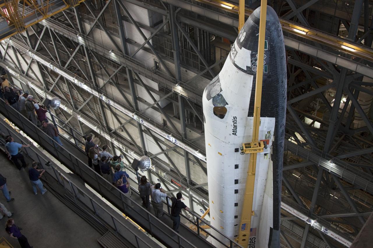 CAPE CANAVERAL, Fla. -- In the Vehicle Assembly Building at NASA's Kennedy Space Center in Florida, shuttle Atlantis is lifted by an overhead crane and moved into a high bay where it will be attached to its external fuel tank and solid rocket boosters already on the mobile launcher platform. Commander Chris Ferguson, Pilot Doug Hurley and Mission Specialists Sandra Magnus and Rex Walheim are expected to launch in mid-July, taking with them the Raffaello multi-purpose logistics module packed with supplies, logistics and spare parts. The STS-135 mission also will fly a system to investigate the potential for robotically refueling existing spacecraft and return a failed ammonia pump module to help NASA better understand the failure mechanism and improve pump designs for future systems. STS-135 will be the 33rd flight of Atlantis, the 37th shuttle mission to the space station, and the 135th and final mission of NASA's Space Shuttle Program. For more information visit, www.nasa.gov/mission_pages/shuttle/shuttlemissions/sts135/index.html. Photo credit: NASA/Troy Cryder