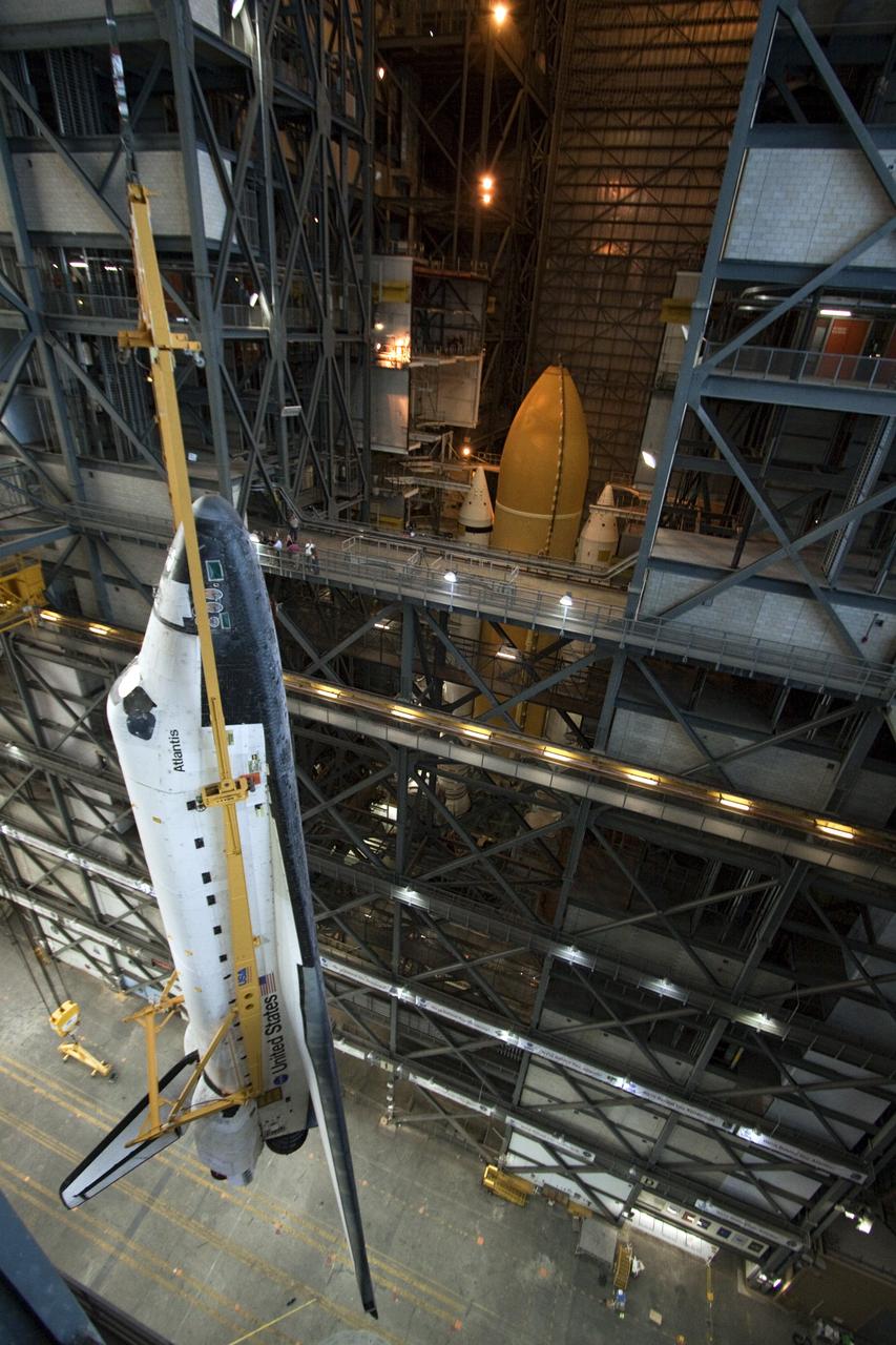 CAPE CANAVERAL, Fla. -- In the Vehicle Assembly Building at NASA's Kennedy Space Center in Florida, shuttle Atlantis is lifted by an overhead crane and moved into a high bay where it will be attached to its external fuel tank and solid rocket boosters already on the mobile launcher platform. Commander Chris Ferguson, Pilot Doug Hurley and Mission Specialists Sandra Magnus and Rex Walheim are expected to launch in mid-July, taking with them the Raffaello multi-purpose logistics module packed with supplies, logistics and spare parts. The STS-135 mission also will fly a system to investigate the potential for robotically refueling existing spacecraft and return a failed ammonia pump module to help NASA better understand the failure mechanism and improve pump designs for future systems. STS-135 will be the 33rd flight of Atlantis, the 37th shuttle mission to the space station, and the 135th and final mission of NASA's Space Shuttle Program. For more information visit, www.nasa.gov/mission_pages/shuttle/shuttlemissions/sts135/index.html. Photo credit: NASA/Troy Cryder