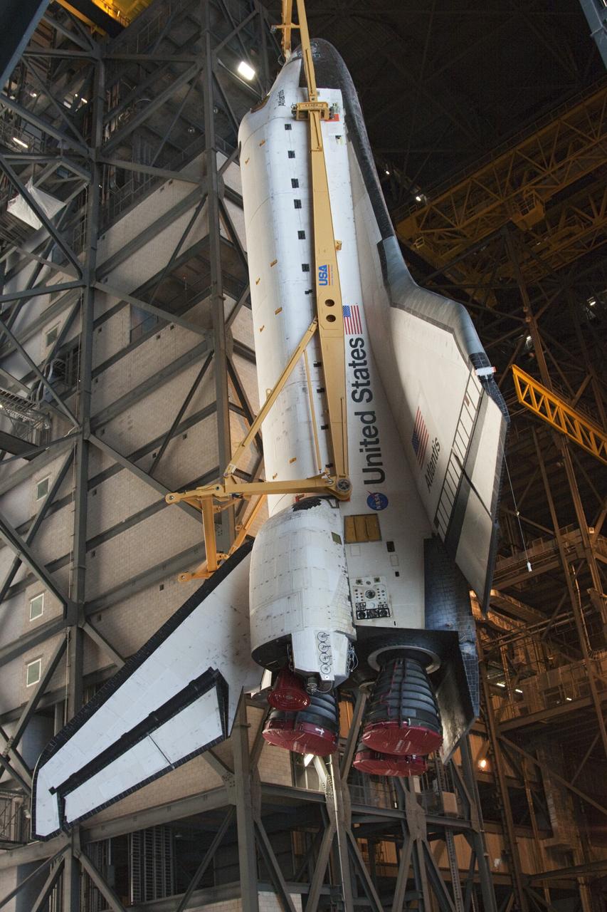 CAPE CANAVERAL, Fla. -- In the Vehicle Assembly Building at NASA's Kennedy Space Center in Florida, shuttle Atlantis is lifted by an overhead crane and moved into a high bay where it will be attached to its external fuel tank and solid rocket boosters already on the mobile launcher platform. Commander Chris Ferguson, Pilot Doug Hurley and Mission Specialists Sandra Magnus and Rex Walheim are expected to launch in mid-July, taking with them the Raffaello multi-purpose logistics module packed with supplies, logistics and spare parts. The STS-135 mission also will fly a system to investigate the potential for robotically refueling existing spacecraft and return a failed ammonia pump module to help NASA better understand the failure mechanism and improve pump designs for future systems. STS-135 will be the 33rd flight of Atlantis, the 37th shuttle mission to the space station, and the 135th and final mission of NASA's Space Shuttle Program. For more information visit, www.nasa.gov/mission_pages/shuttle/shuttlemissions/sts135/index.html. Photo credit: NASA/Troy Cryder