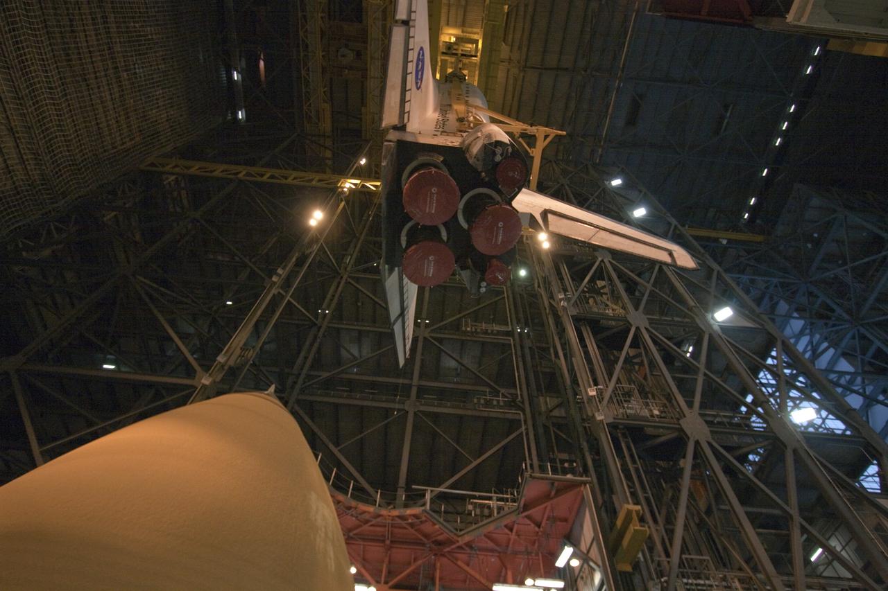 CAPE CANAVERAL, Fla. -- In the Vehicle Assembly Building at NASA's Kennedy Space Center in Florida, shuttle Atlantis is lowered by an overhead crane into a high bay where it will be attached to its external fuel tank and solid rocket boosters already on the mobile launcher platform. Commander Chris Ferguson, Pilot Doug Hurley and Mission Specialists Sandra Magnus and Rex Walheim are expected to launch in mid-July, taking with them the Raffaello multi-purpose logistics module packed with supplies, logistics and spare parts. The STS-135 mission also will fly a system to investigate the potential for robotically refueling existing spacecraft and return a failed ammonia pump module to help NASA better understand the failure mechanism and improve pump designs for future systems. STS-135 will be the 33rd flight of Atlantis, the 37th shuttle mission to the space station, and the 135th and final mission of NASA's Space Shuttle Program. For more information visit, www.nasa.gov/mission_pages/shuttle/shuttlemissions/sts135/index.html. Photo credit: NASA/Troy Cryder