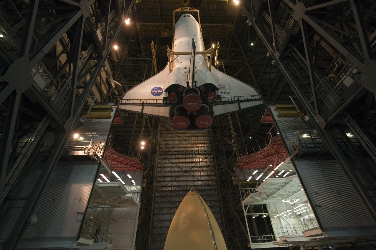 CAPE CANAVERAL, Fla. -- In the Vehicle Assembly Building at NASA's Kennedy Space Center in Florida, shuttle Atlantis is lowered by an overhead crane into a high bay where it will be attached to its external fuel tank and solid rocket boosters already on the mobile launcher platform. Commander Chris Ferguson, Pilot Doug Hurley and Mission Specialists Sandra Magnus and Rex Walheim are expected to launch in mid-July, taking with them the Raffaello multi-purpose logistics module packed with supplies, logistics and spare parts. The STS-135 mission also will fly a system to investigate the potential for robotically refueling existing spacecraft and return a failed ammonia pump module to help NASA better understand the failure mechanism and improve pump designs for future systems. STS-135 will be the 33rd flight of Atlantis, the 37th shuttle mission to the space station, and the 135th and final mission of NASA's Space Shuttle Program. For more information visit, www.nasa.gov/mission_pages/shuttle/shuttlemissions/sts135/index.html. Photo credit: NASA/Troy Cryder