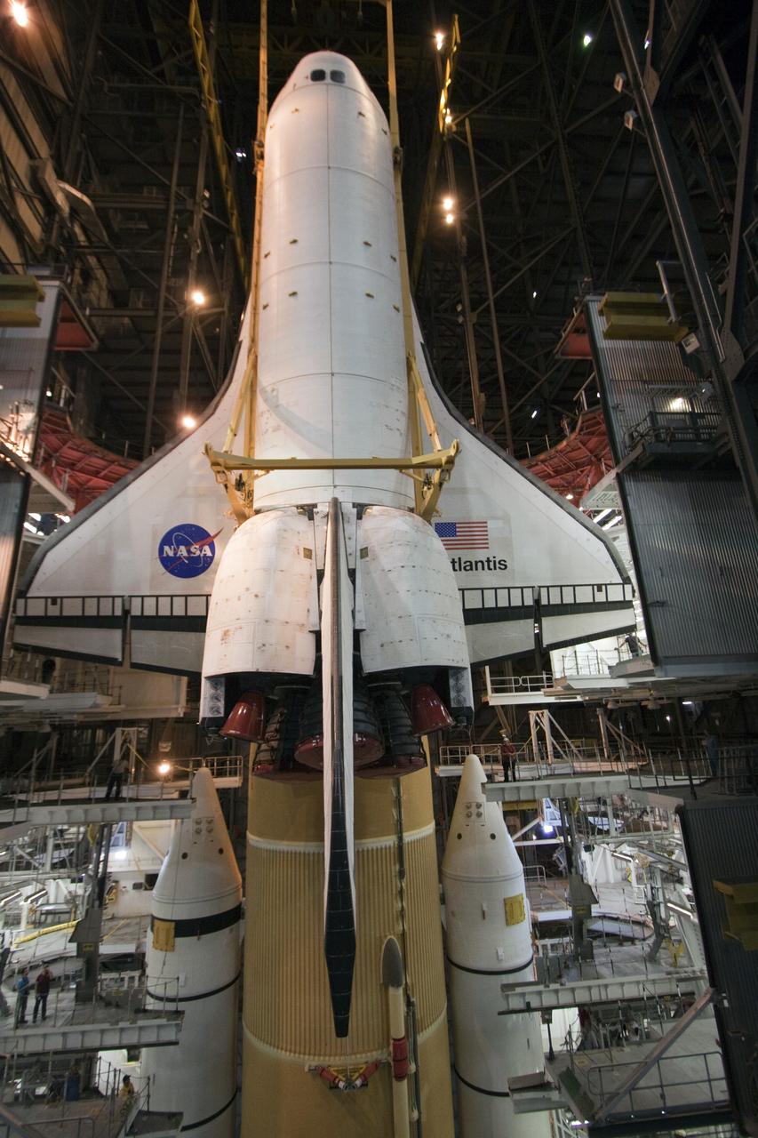 CAPE CANAVERAL, Fla. -- In the Vehicle Assembly Building at NASA's Kennedy Space Center in Florida, shuttle Atlantis is lowered by an overhead crane into a high bay where it will be attached to its external fuel tank and solid rocket boosters already on the mobile launcher platform. Commander Chris Ferguson, Pilot Doug Hurley and Mission Specialists Sandra Magnus and Rex Walheim are expected to launch in mid-July, taking with them the Raffaello multi-purpose logistics module packed with supplies, logistics and spare parts. The STS-135 mission also will fly a system to investigate the potential for robotically refueling existing spacecraft and return a failed ammonia pump module to help NASA better understand the failure mechanism and improve pump designs for future systems. STS-135 will be the 33rd flight of Atlantis, the 37th shuttle mission to the space station, and the 135th and final mission of NASA's Space Shuttle Program. For more information visit, www.nasa.gov/mission_pages/shuttle/shuttlemissions/sts135/index.html. Photo credit: NASA/Troy Cryder