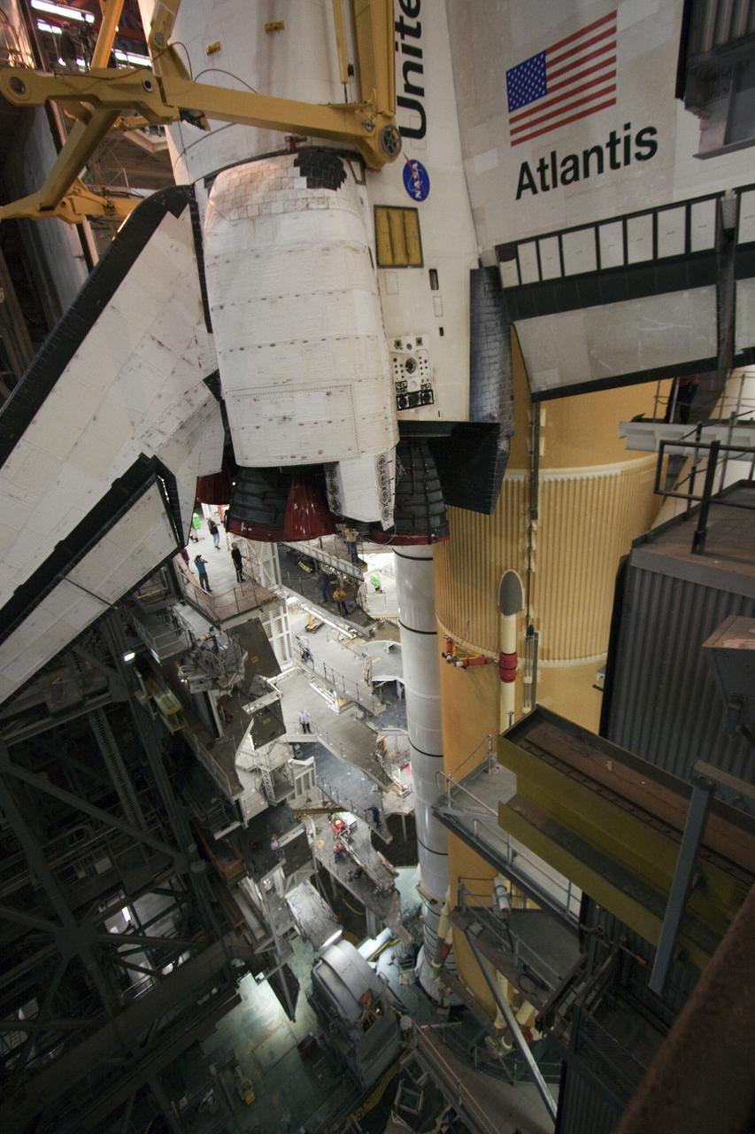 CAPE CANAVERAL, Fla. -- In the Vehicle Assembly Building at NASA's Kennedy Space Center in Florida, shuttle Atlantis is lowered by an overhead crane into a high bay where it will be attached to its external fuel tank and solid rocket boosters already on the mobile launcher platform. Commander Chris Ferguson, Pilot Doug Hurley and Mission Specialists Sandra Magnus and Rex Walheim are expected to launch in mid-July, taking with them the Raffaello multi-purpose logistics module packed with supplies, logistics and spare parts. The STS-135 mission also will fly a system to investigate the potential for robotically refueling existing spacecraft and return a failed ammonia pump module to help NASA better understand the failure mechanism and improve pump designs for future systems. STS-135 will be the 33rd flight of Atlantis, the 37th shuttle mission to the space station, and the 135th and final mission of NASA's Space Shuttle Program. For more information visit, www.nasa.gov/mission_pages/shuttle/shuttlemissions/sts135/index.html. Photo credit: NASA/Troy Cryder