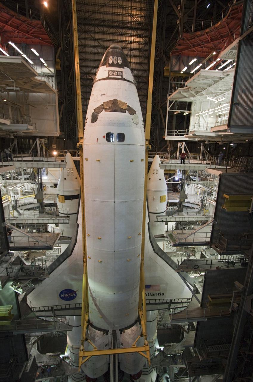 CAPE CANAVERAL, Fla. -- In the Vehicle Assembly Building at NASA's Kennedy Space Center in Florida, shuttle Atlantis is lowered onto the mobile launcher platform where it will be joined with its external fuel tank and solid rocket boosters. Commander Chris Ferguson, Pilot Doug Hurley and Mission Specialists Sandra Magnus and Rex Walheim are expected to launch in mid-July, taking with them the Raffaello multi-purpose logistics module packed with supplies, logistics and spare parts. The STS-135 mission also will fly a system to investigate the potential for robotically refueling existing spacecraft and return a failed ammonia pump module to help NASA better understand the failure mechanism and improve pump designs for future systems. STS-135 will be the 33rd flight of Atlantis, the 37th shuttle mission to the space station, and the 135th and final mission of NASA's Space Shuttle Program. For more information visit, www.nasa.gov/mission_pages/shuttle/shuttlemissions/sts135/index.html. Photo credit: NASA/Troy Cryder
