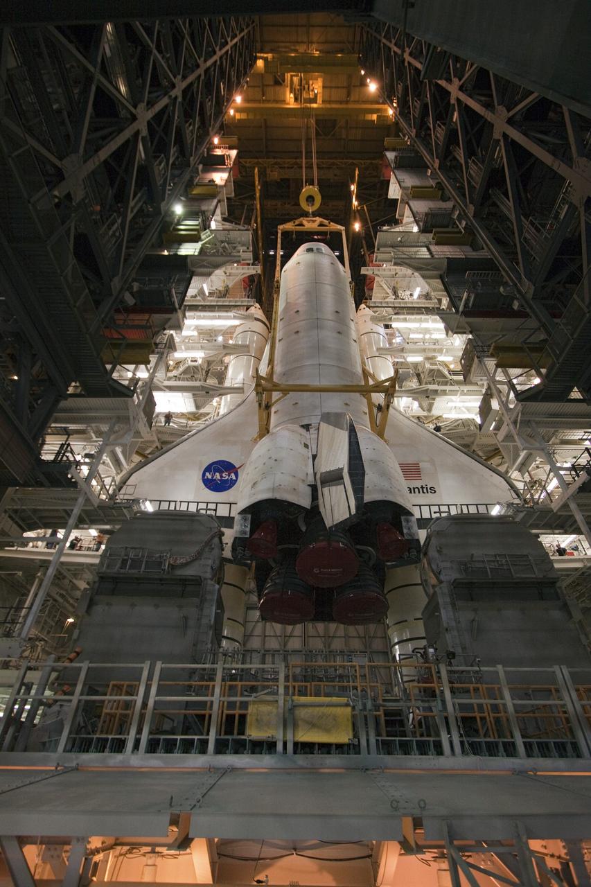 CAPE CANAVERAL, Fla. -- In the Vehicle Assembly Building at NASA's Kennedy Space Center in Florida, shuttle Atlantis is lowered onto the mobile launcher platform where it will be joined with its external fuel tank and solid rocket boosters. Commander Chris Ferguson, Pilot Doug Hurley and Mission Specialists Sandra Magnus and Rex Walheim are expected to launch in mid-July, taking with them the Raffaello multi-purpose logistics module packed with supplies, logistics and spare parts. The STS-135 mission also will fly a system to investigate the potential for robotically refueling existing spacecraft and return a failed ammonia pump module to help NASA better understand the failure mechanism and improve pump designs for future systems. STS-135 will be the 33rd flight of Atlantis, the 37th shuttle mission to the space station, and the 135th and final mission of NASA's Space Shuttle Program. For more information visit, www.nasa.gov/mission_pages/shuttle/shuttlemissions/sts135/index.html. Photo credit: NASA/Troy Cryder