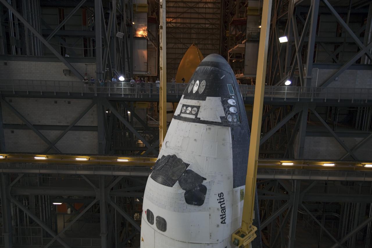 CAPE CANAVERAL, Fla. -- In the Vehicle Assembly Building at NASA's Kennedy Space Center in Florida, shuttle Atlantis is lifted by an overhead crane and moved into a high bay where it will be attached to its external fuel tank and solid rocket boosters which are already on the mobile launcher platform. Commander Chris Ferguson, Pilot Doug Hurley and Mission Specialists Sandra Magnus and Rex Walheim are expected to launch in mid-July, taking with them the Raffaello multi-purpose logistics module packed with supplies, logistics and spare parts. The STS-135 mission also will fly a system to investigate the potential for robotically refueling existing spacecraft and return a failed ammonia pump module to help NASA better understand the failure mechanism and improve pump designs for future systems. STS-135 will be the 33rd flight of Atlantis, the 37th shuttle mission to the space station, and the 135th and final mission of NASA's Space Shuttle Program. For more information visit, www.nasa.gov/mission_pages/shuttle/shuttlemissions/sts135/index.html. Photo credit: NASA/Dimitri Gerondidakis