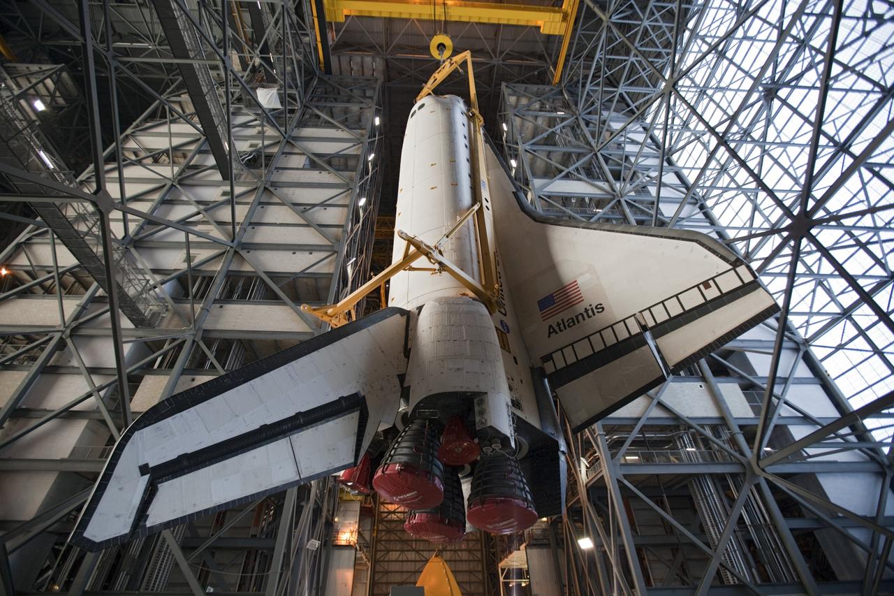 CAPE CANAVERAL, Fla. -- In the Vehicle Assembly Building at NASA's Kennedy Space Center in Florida, shuttle Atlantis is lifted by an overhead crane and moved into a high bay where it will be attached to its external fuel tank and solid rocket boosters which are already on the mobile launcher platform. Commander Chris Ferguson, Pilot Doug Hurley and Mission Specialists Sandra Magnus and Rex Walheim are expected to launch in mid-July, taking with them the Raffaello multi-purpose logistics module packed with supplies, logistics and spare parts. The STS-135 mission also will fly a system to investigate the potential for robotically refueling existing spacecraft and return a failed ammonia pump module to help NASA better understand the failure mechanism and improve pump designs for future systems. STS-135 will be the 33rd flight of Atlantis, the 37th shuttle mission to the space station, and the 135th and final mission of NASA's Space Shuttle Program. For more information visit, www.nasa.gov/mission_pages/shuttle/shuttlemissions/sts135/index.html. Photo credit: NASA/Dimitri Gerondidakis