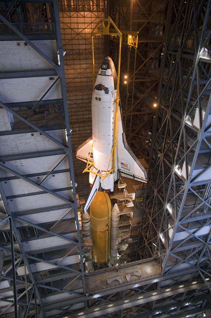 CAPE CANAVERAL, Fla. -- In the Vehicle Assembly Building at NASA's Kennedy Space Center in Florida, shuttle Atlantis is lowered by an overhead crane into a high bay where it will be attached to its external fuel tank and solid rocket boosters which are already on the mobile launcher platform. Commander Chris Ferguson, Pilot Doug Hurley and Mission Specialists Sandra Magnus and Rex Walheim are expected to launch in mid-July, taking with them the Raffaello multi-purpose logistics module packed with supplies, logistics and spare parts. The STS-135 mission also will fly a system to investigate the potential for robotically refueling existing spacecraft and return a failed ammonia pump module to help NASA better understand the failure mechanism and improve pump designs for future systems. STS-135 will be the 33rd flight of Atlantis, the 37th shuttle mission to the space station, and the 135th and final mission of NASA's Space Shuttle Program. For more information visit, www.nasa.gov/mission_pages/shuttle/shuttlemissions/sts135/index.html. Photo credit: NASA/Dimitri Gerondidakis