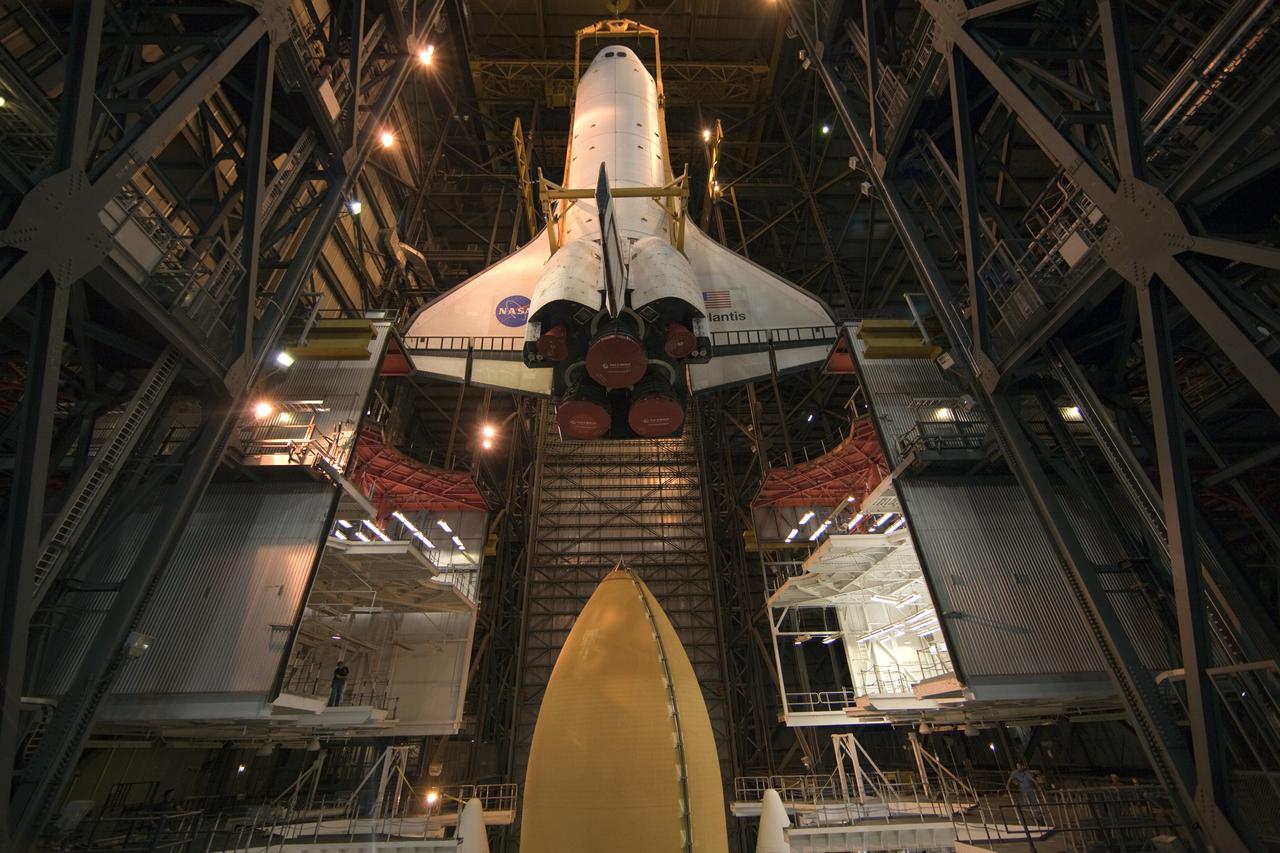 CAPE CANAVERAL, Fla. -- In the Vehicle Assembly Building at NASA's Kennedy Space Center in Florida, shuttle Atlantis is lowered toward the mobile launcher platform where it will be joined with its external fuel tank and solid rocket boosters. Commander Chris Ferguson, Pilot Doug Hurley and Mission Specialists Sandra Magnus and Rex Walheim are expected to launch in mid-July, taking with them the Raffaello multi-purpose logistics module packed with supplies, logistics and spare parts. The STS-135 mission also will fly a system to investigate the potential for robotically refueling existing spacecraft and return a failed ammonia pump module to help NASA better understand the failure mechanism and improve pump designs for future systems. STS-135 will be the 33rd flight of Atlantis, the 37th shuttle mission to the space station, and the 135th and final mission of NASA's Space Shuttle Program. For more information visit, www.nasa.gov/mission_pages/shuttle/shuttlemissions/sts135/index.html. Photo credit: NASA/Dimitri Gerondidakis