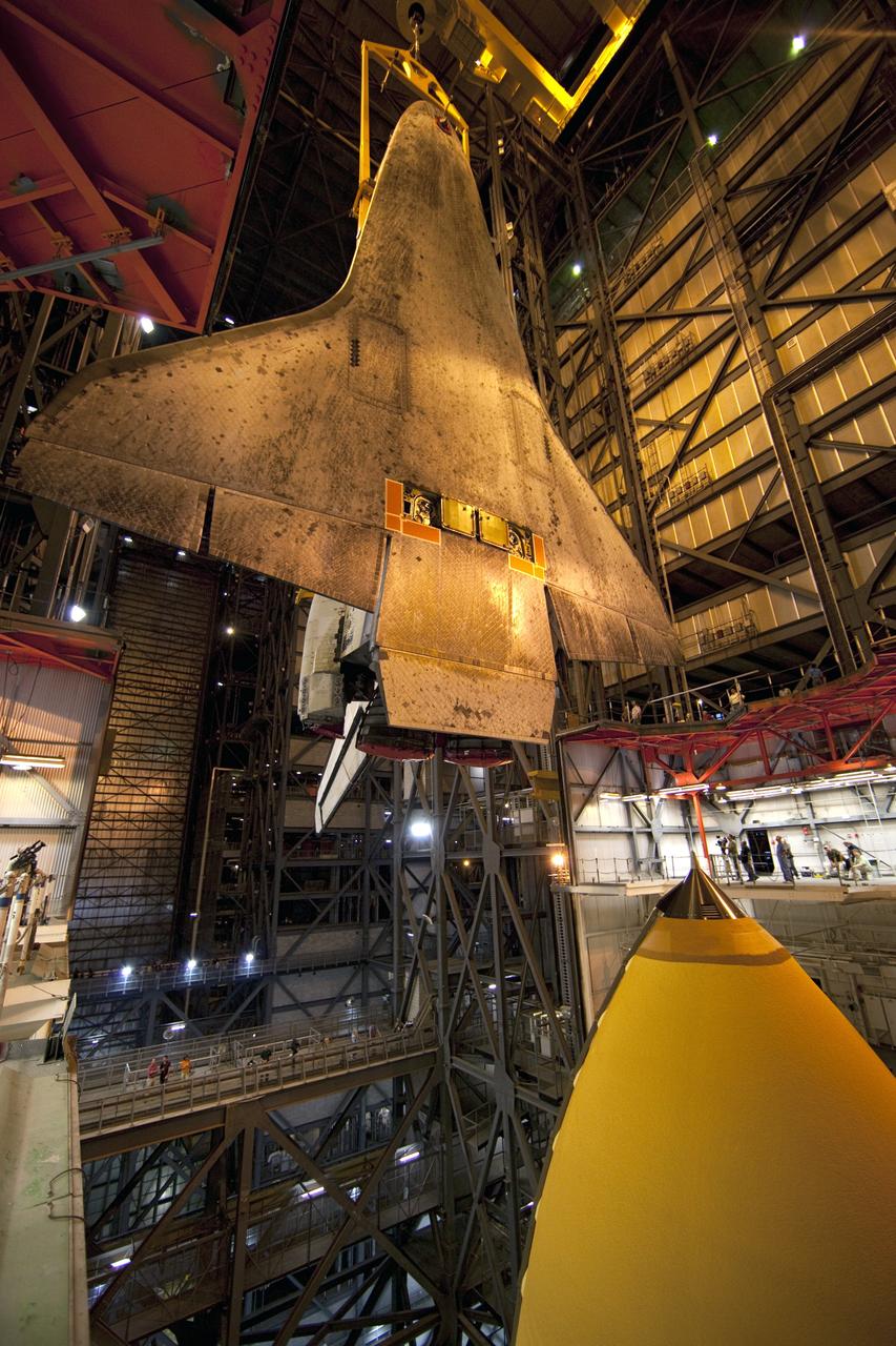 CAPE CANAVERAL, Fla. -- In the Vehicle Assembly Building at NASA's Kennedy Space Center in Florida, shuttle Atlantis is lowered toward the mobile launcher platform where it will be joined with its external fuel tank and solid rocket boosters. Commander Chris Ferguson, Pilot Doug Hurley and Mission Specialists Sandra Magnus and Rex Walheim are expected to launch in mid-July, taking with them the Raffaello multi-purpose logistics module packed with supplies, logistics and spare parts. The STS-135 mission also will fly a system to investigate the potential for robotically refueling existing spacecraft and return a failed ammonia pump module to help NASA better understand the failure mechanism and improve pump designs for future systems. STS-135 will be the 33rd flight of Atlantis, the 37th shuttle mission to the space station, and the 135th and final mission of NASA's Space Shuttle Program. For more information visit, www.nasa.gov/mission_pages/shuttle/shuttlemissions/sts135/index.html. Photo credit: NASA/Dimitri Gerondidakis