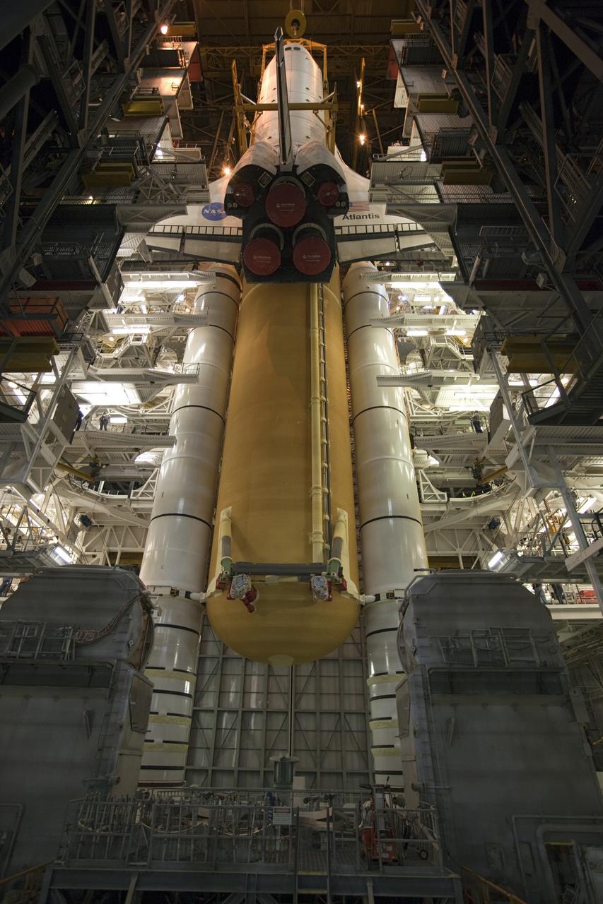 CAPE CANAVERAL, Fla. -- In the Vehicle Assembly Building at NASA's Kennedy Space Center in Florida, shuttle Atlantis is lowered toward the mobile launcher platform where it will be joined with its external fuel tank and solid rocket boosters. Commander Chris Ferguson, Pilot Doug Hurley and Mission Specialists Sandra Magnus and Rex Walheim are expected to launch in mid-July, taking with them the Raffaello multi-purpose logistics module packed with supplies, logistics and spare parts. The STS-135 mission also will fly a system to investigate the potential for robotically refueling existing spacecraft and return a failed ammonia pump module to help NASA better understand the failure mechanism and improve pump designs for future systems. STS-135 will be the 33rd flight of Atlantis, the 37th shuttle mission to the space station, and the 135th and final mission of NASA's Space Shuttle Program. For more information visit, www.nasa.gov/mission_pages/shuttle/shuttlemissions/sts135/index.html. Photo credit: NASA/Dimitri Gerondidakis