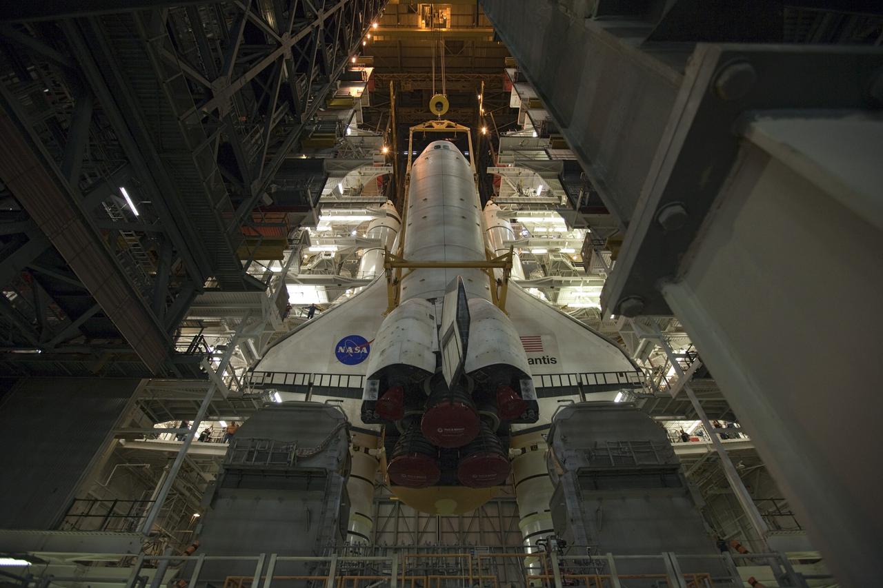 CAPE CANAVERAL, Fla. -- In the Vehicle Assembly Building at NASA's Kennedy Space Center in Florida, shuttle Atlantis is lowered toward the mobile launcher platform where it will be joined with its external fuel tank and solid rocket boosters. Commander Chris Ferguson, Pilot Doug Hurley and Mission Specialists Sandra Magnus and Rex Walheim are expected to launch in mid-July, taking with them the Raffaello multi-purpose logistics module packed with supplies, logistics and spare parts. The STS-135 mission also will fly a system to investigate the potential for robotically refueling existing spacecraft and return a failed ammonia pump module to help NASA better understand the failure mechanism and improve pump designs for future systems. STS-135 will be the 33rd flight of Atlantis, the 37th shuttle mission to the space station, and the 135th and final mission of NASA's Space Shuttle Program. For more information visit, www.nasa.gov/mission_pages/shuttle/shuttlemissions/sts135/index.html. Photo credit: NASA/Dimitri Gerondidakis
