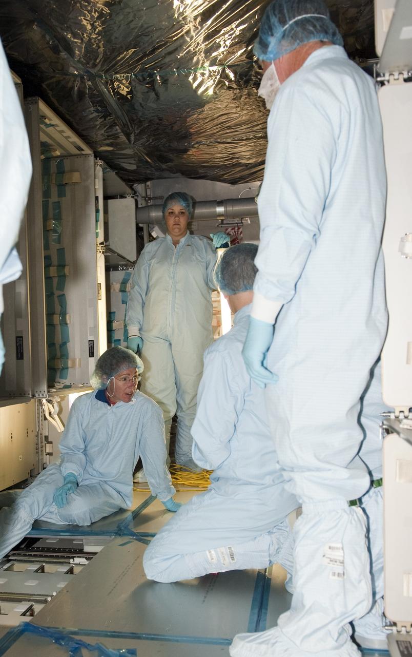 CAPE CANAVERAL, Fla. -- In the Space Station Processing Facility at NASA's Kennedy Space Center in Florida, STS-135 Mission Specialist Sandra Magnus and facility technicians garbed in protective wear, inspect the Raffaello multi-purpose logistics module for shuttle Atlantis' flight to the International Space Station. Commander Chris Ferguson, Pilot Doug Hurley and Mission Specialists Sandra Magnus and Rex Walheim are targeted to launch on July 8, taking with them the Raffaello multi-purpose logistics module packed with supplies, logistics and spare parts. The STS-135 mission also will fly a system to investigate the potential for robotically refueling existing spacecraft and return a failed ammonia pump module to help NASA better understand the failure mechanism and improve pump designs for future systems. STS-135 will be the 33rd flight of Atlantis, the 37th shuttle mission to the space station, and the 135th and final mission of NASA's Space Shuttle Program. For more information visit, www.nasa.gov/mission_pages/shuttle/shuttlemissions/sts135/index.html. Photo credit: NASA/Kim Shiflett