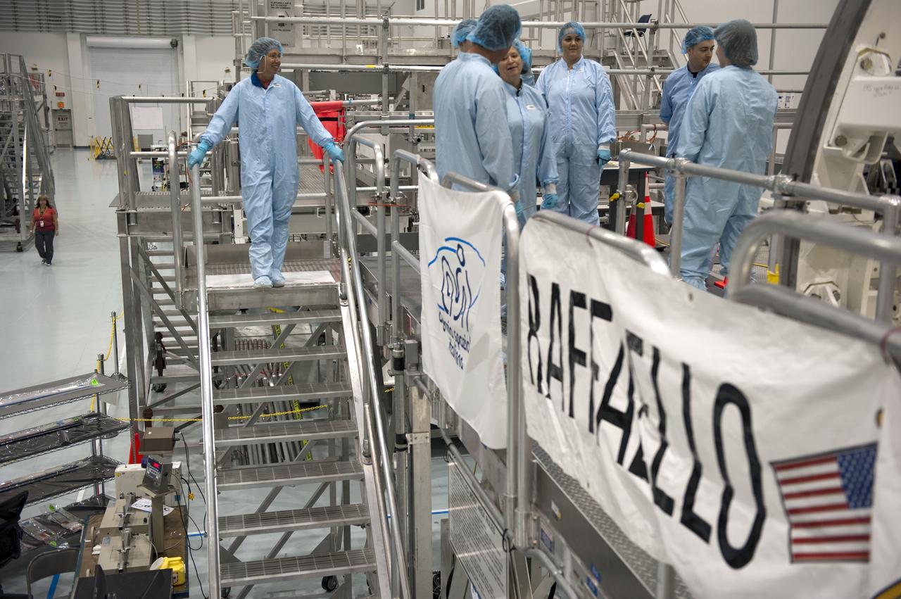 CAPE CANAVERAL, Fla. -- In the Space Station Processing Facility at NASA's Kennedy Space Center in Florida, STS-135 Mission Specialist Sandra Magnus and facility technicians garbed in protective wear, have completed their inspection of the Raffaello multi-purpose logistics module for shuttle Atlantis' flight to the International Space Station. Commander Chris Ferguson, Pilot Doug Hurley and Mission Specialists Sandra Magnus and Rex Walheim are targeted to launch on July 8, taking with them the Raffaello multi-purpose logistics module packed with supplies, logistics and spare parts. The STS-135 mission also will fly a system to investigate the potential for robotically refueling existing spacecraft and return a failed ammonia pump module to help NASA better understand the failure mechanism and improve pump designs for future systems. STS-135 will be the 33rd flight of Atlantis, the 37th shuttle mission to the space station, and the 135th and final mission of NASA's Space Shuttle Program. For more information visit, www.nasa.gov/mission_pages/shuttle/shuttlemissions/sts135/index.html. Photo credit: NASA/Kim Shiflett