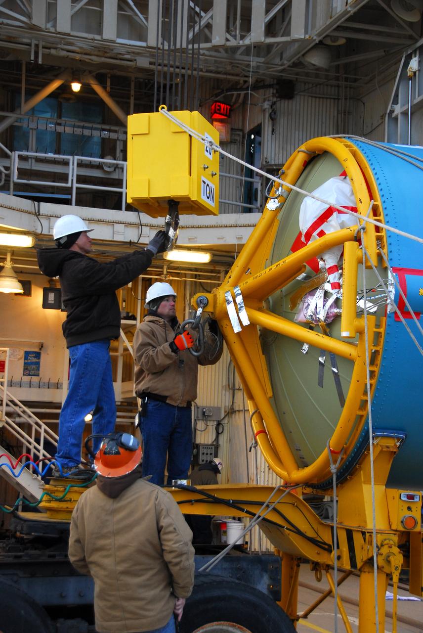 VANDENBERG AIR FORCE BASE, Calif. --  Workers prepare the first stage of the United Launch Alliance Delta II rocket that will carry the Aquarius/SAC-D spacecraft into low Earth orbit, for its vertical lift into the service tower at NASA's Space Launch Complex-2 (SLC-2) at Vandenberg Air Force Base in California.             Following final tests, the spacecraft will be integrated to the Delta II in preparation for the targeted June launch. Aquarius, the NASA-built instrument on the SAC-D spacecraft, on its three-year mission, will provide new insights into how variations in ocean surface salinity relate to fundamental climate processes. Photo credit: NASA/VAFB